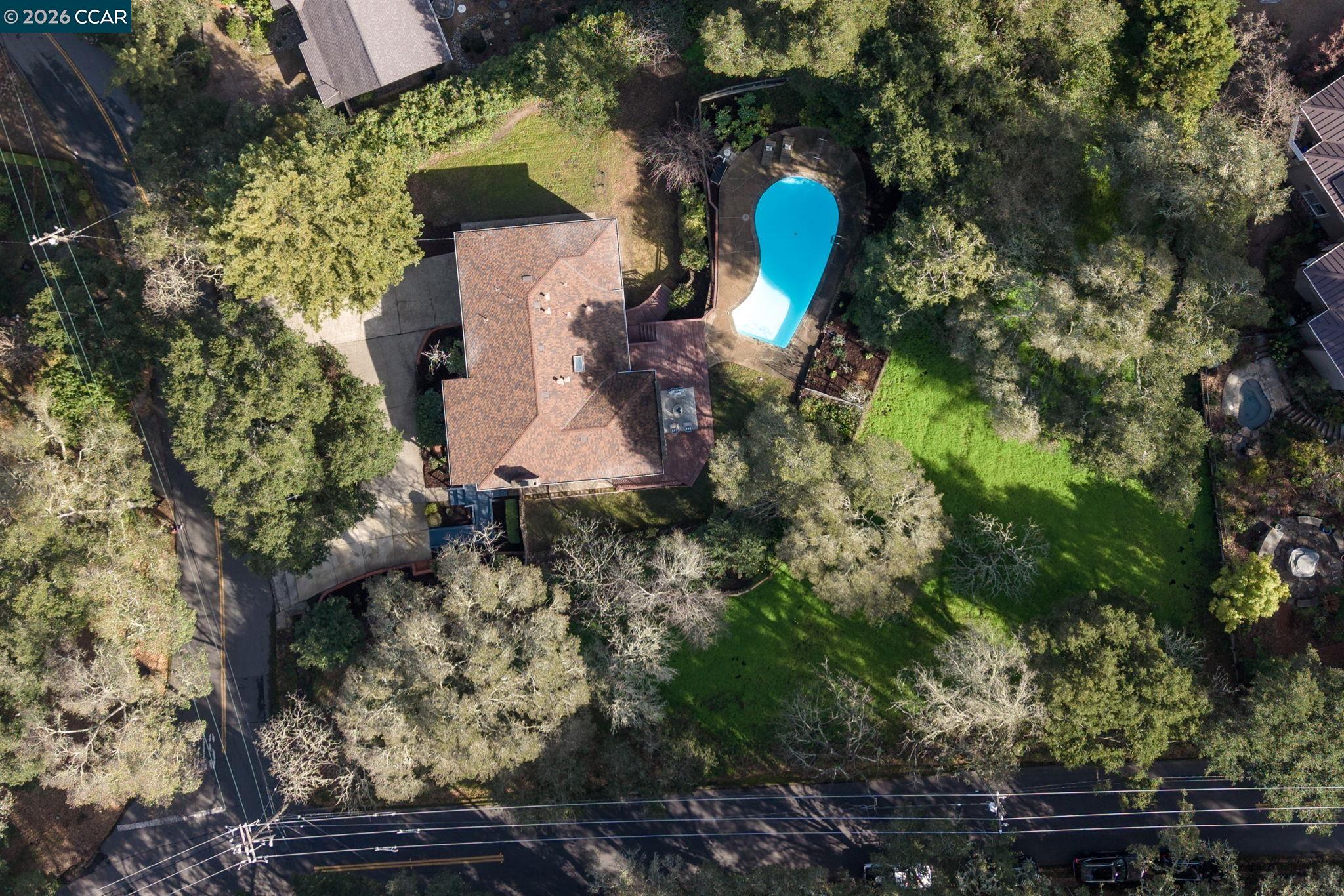 700 Miner Road Orinda, CA 94563 - Photo 35 of 37 an aerial view of a house with a yard and large trees