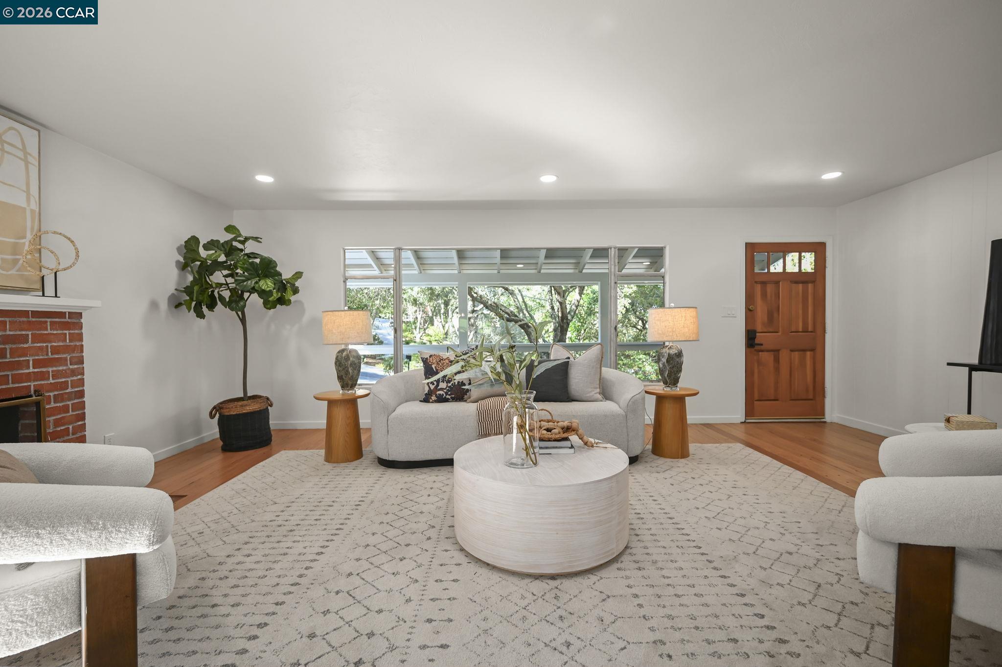 700 Miner Road Orinda, CA 94563 - Photo 5 of 37 a living room with furniture and potted plants