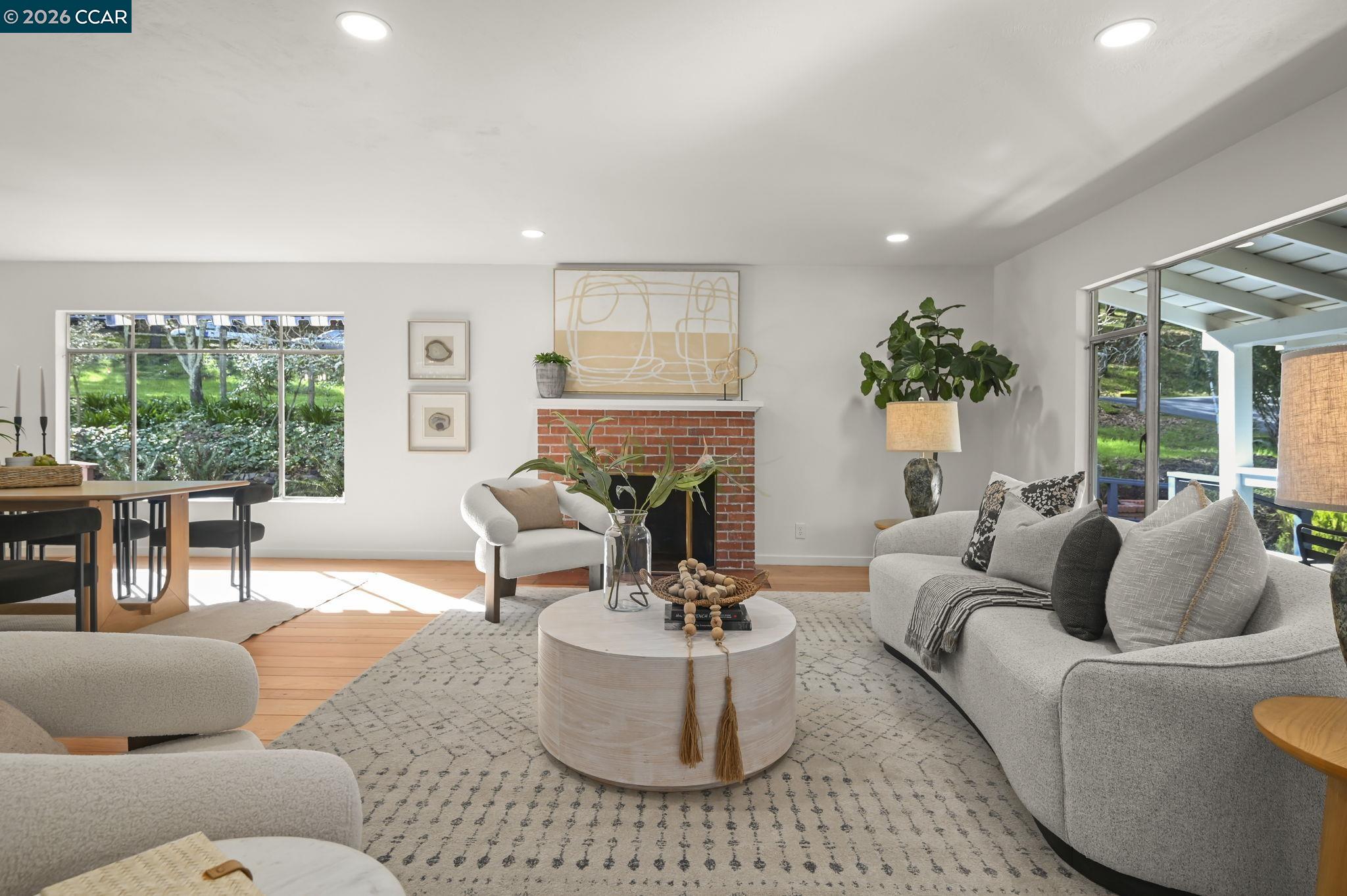 700 Miner Road Orinda, CA 94563 - Photo 6 of 37 a living room with furniture and a large window