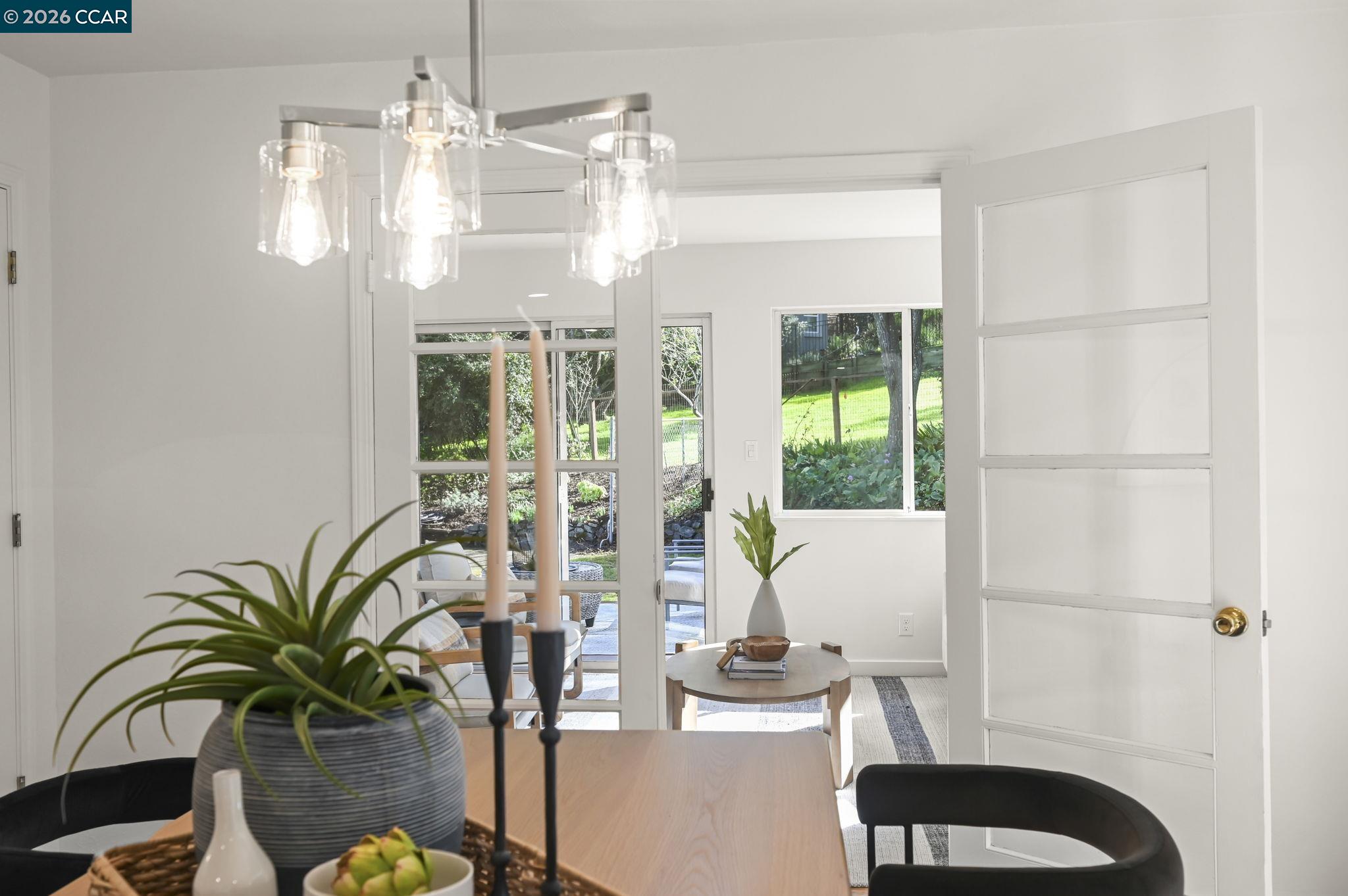 700 Miner Road Orinda, CA 94563 - Photo 10 of 37 a vase of flowers sitting on a table with window