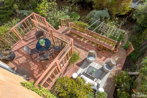 an aerial view of residential house with outdoor space and swimming pool