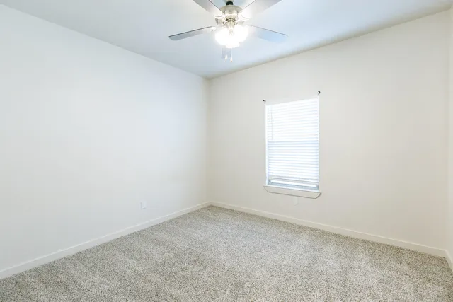 an empty room with a bathroom