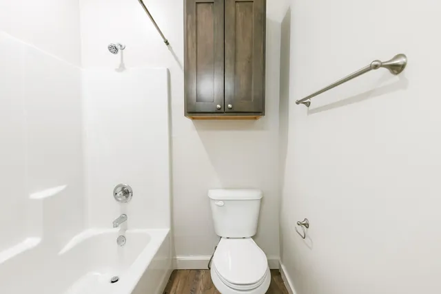 a view of backyard with outdoor seating and wooden floor