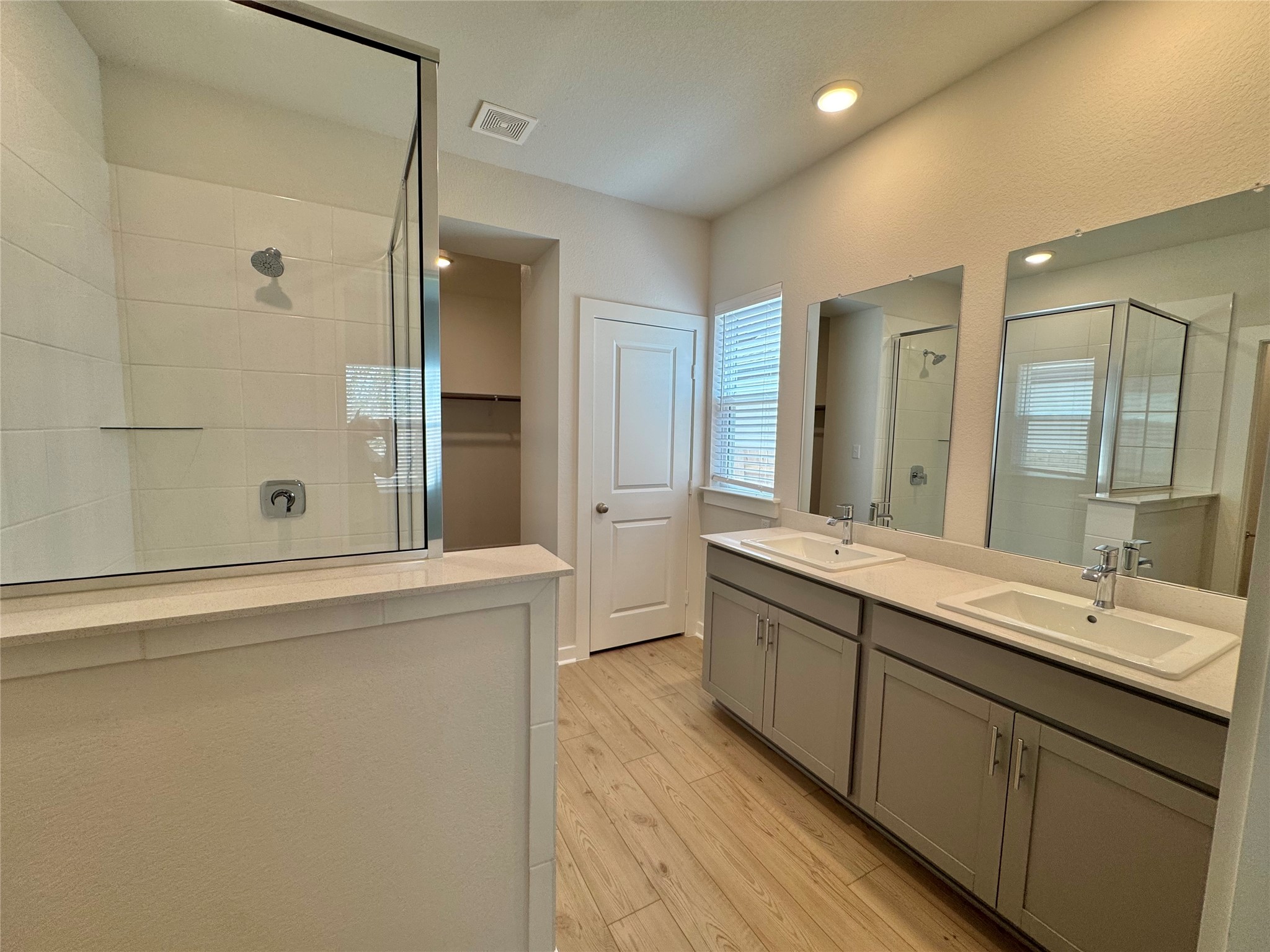 109 Corn Lane Hutto, TX 78634 - Photo 15 of 35 a bathroom with a double vanity sink mirror and double