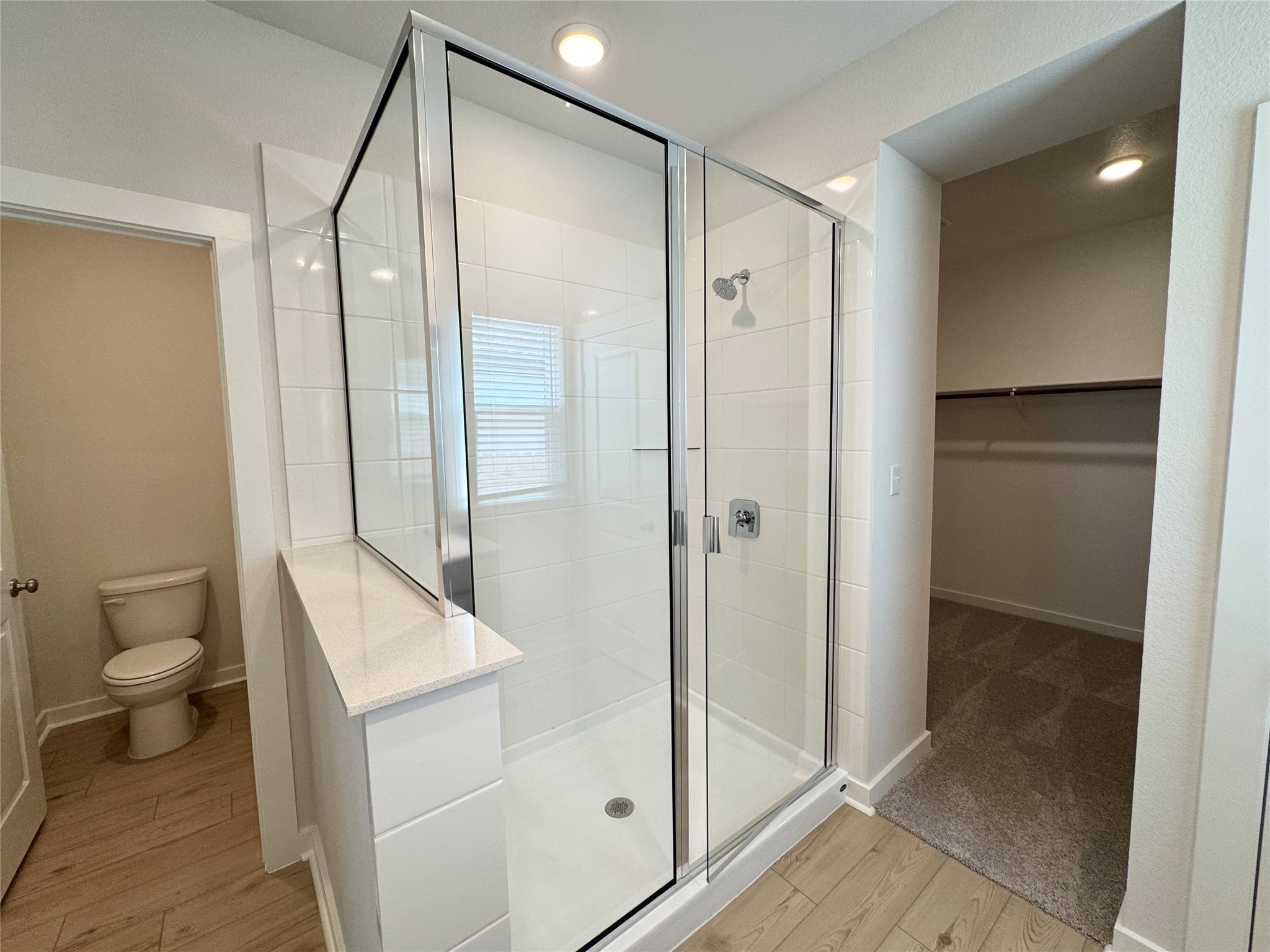 109 Corn Lane Hutto, TX 78634 - Photo 18 of 35 a bathroom with a shower and a toilet