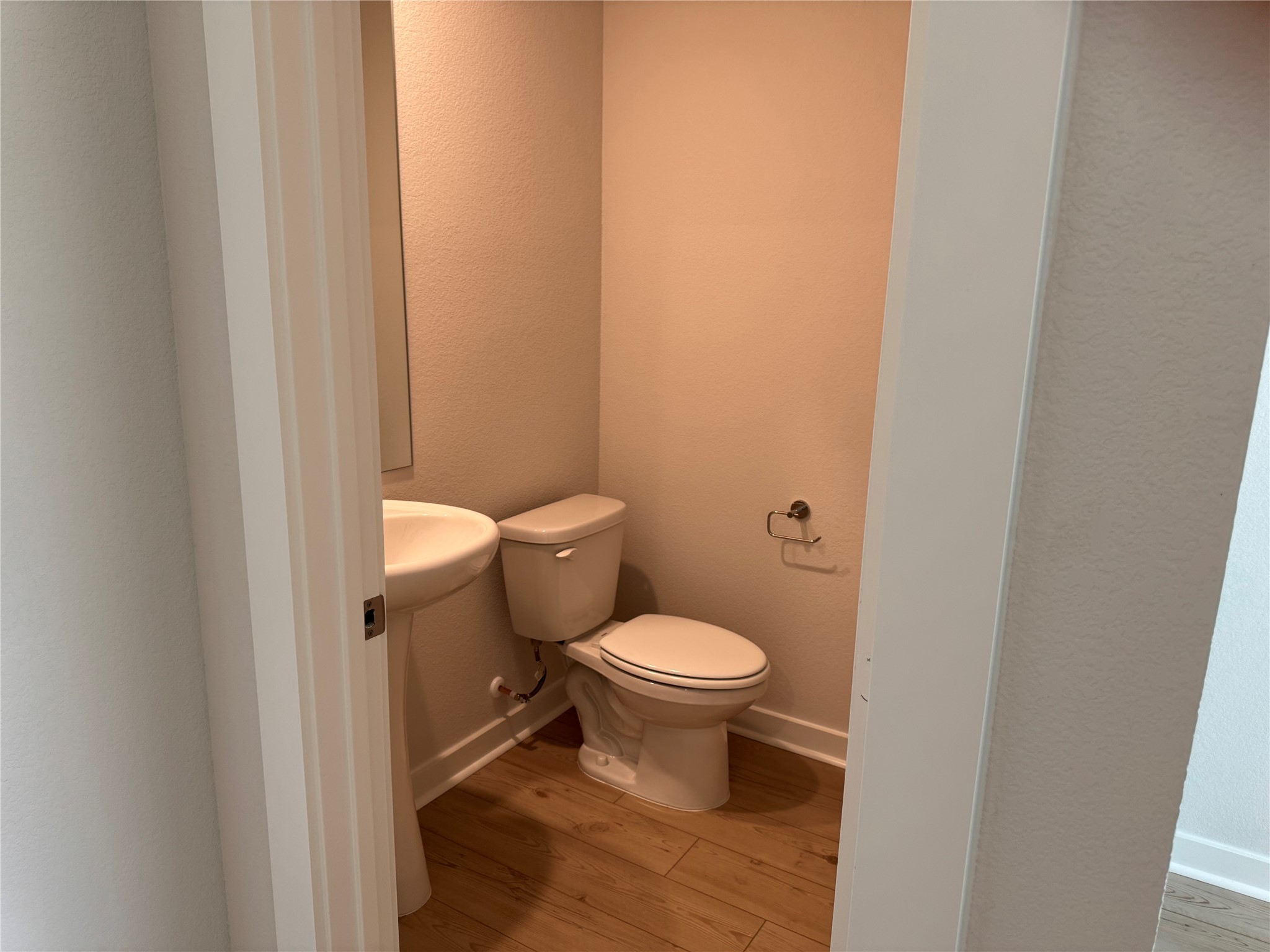 109 Corn Lane Hutto, TX 78634 - Photo 32 of 35 a white toilet sitting next to a white wall