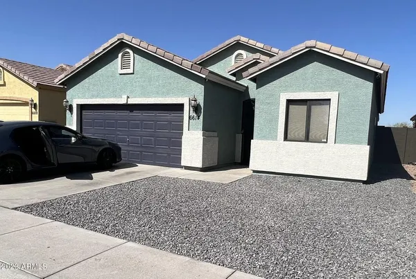 a front view of a house with yard