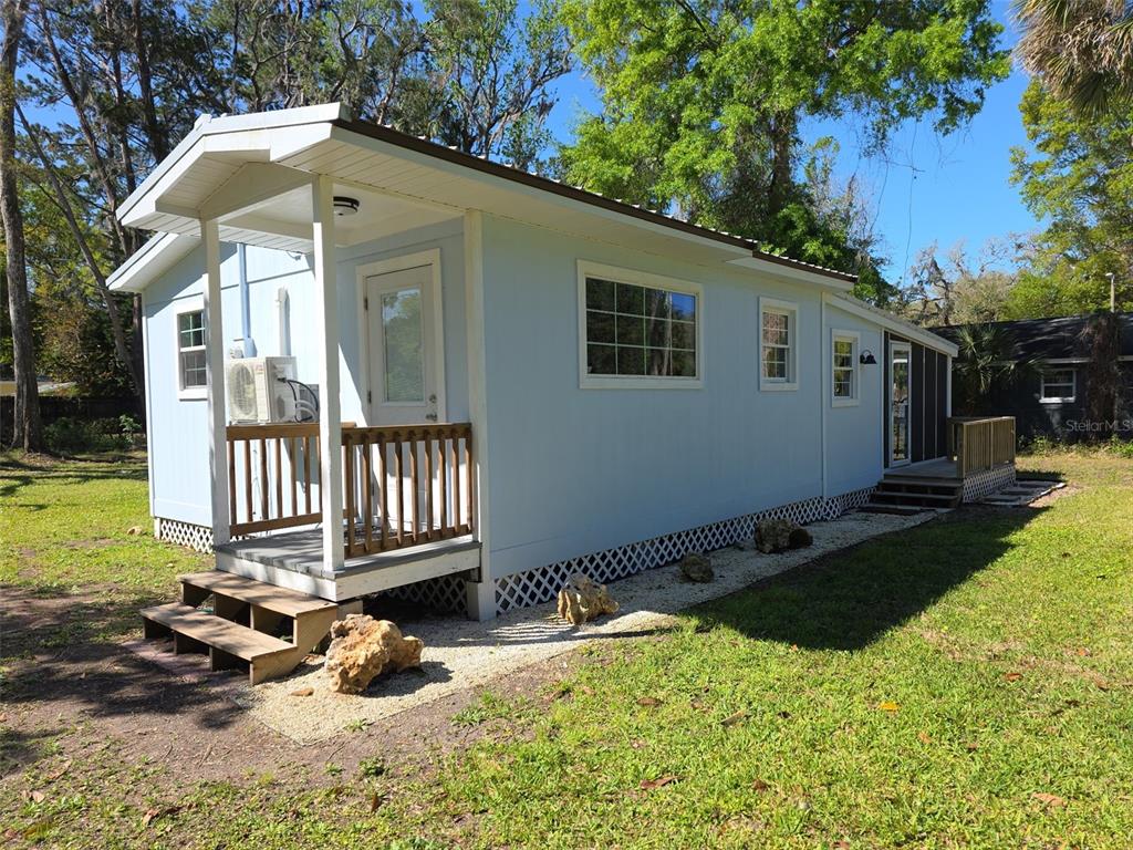 10568 West Oliver Street Homosassa, FL 34448 - Photo 1 of 1 a front view of a house with a yard