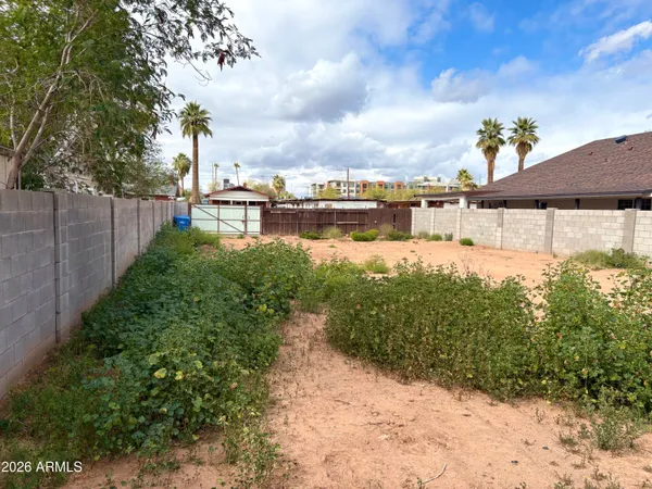 a view of a lake with a house in the background
