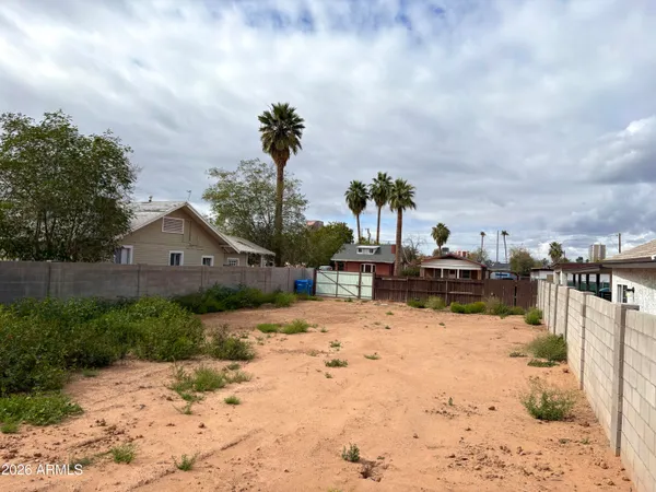 a view of a house with a yard covered in snow