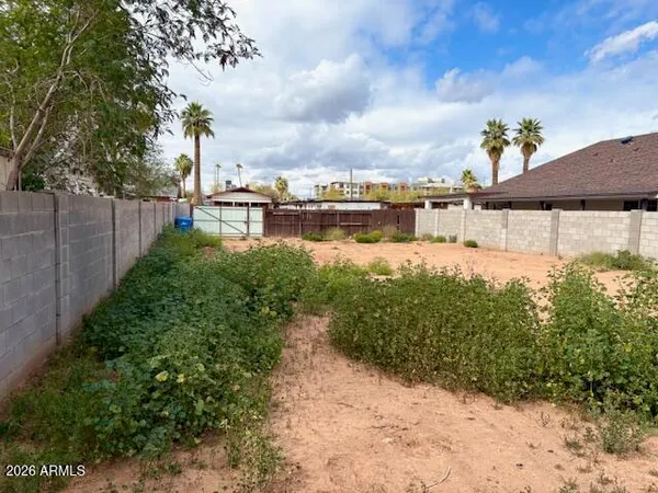 a view of a lake with a house in the background