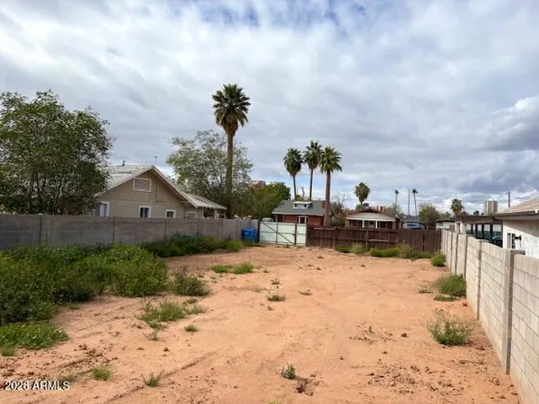 a view of a house with a yard covered in snow
