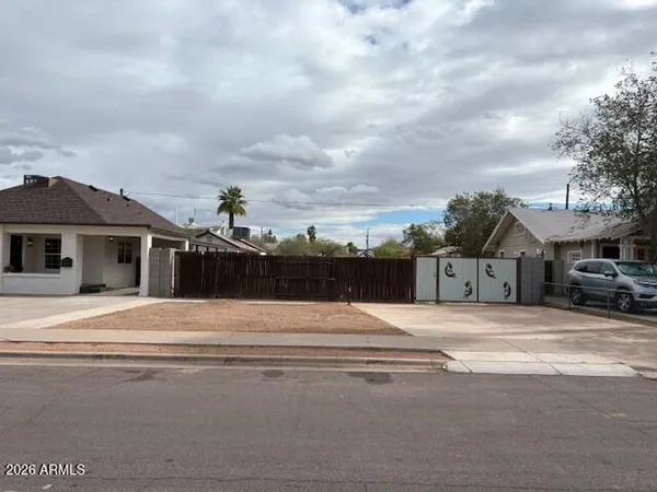 an outdoor view of house and garage