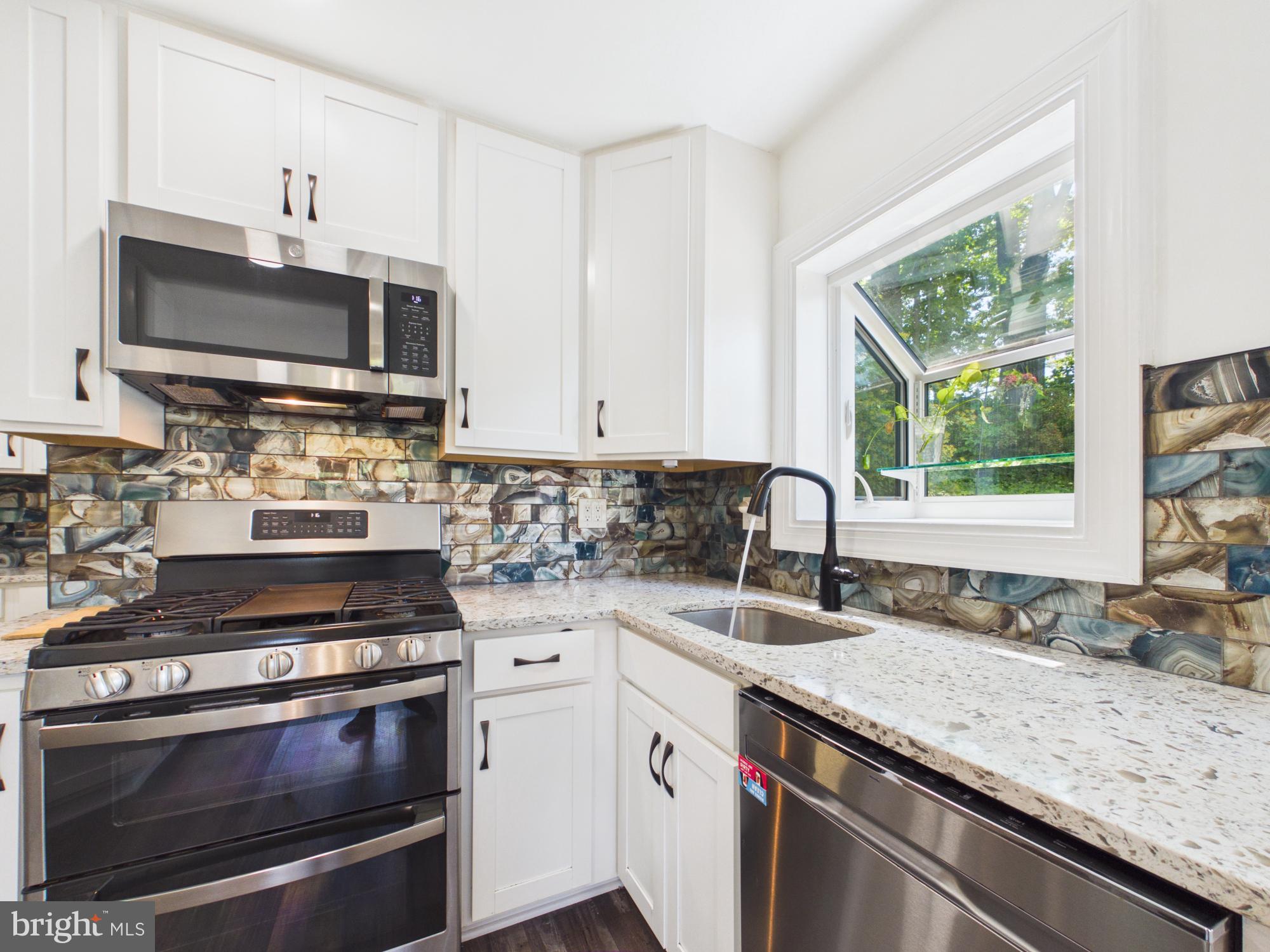 5512 Kathleen Place Springfield, VA 22151 - Photo 15 of 42 Modern kitchen with stylish finishes.