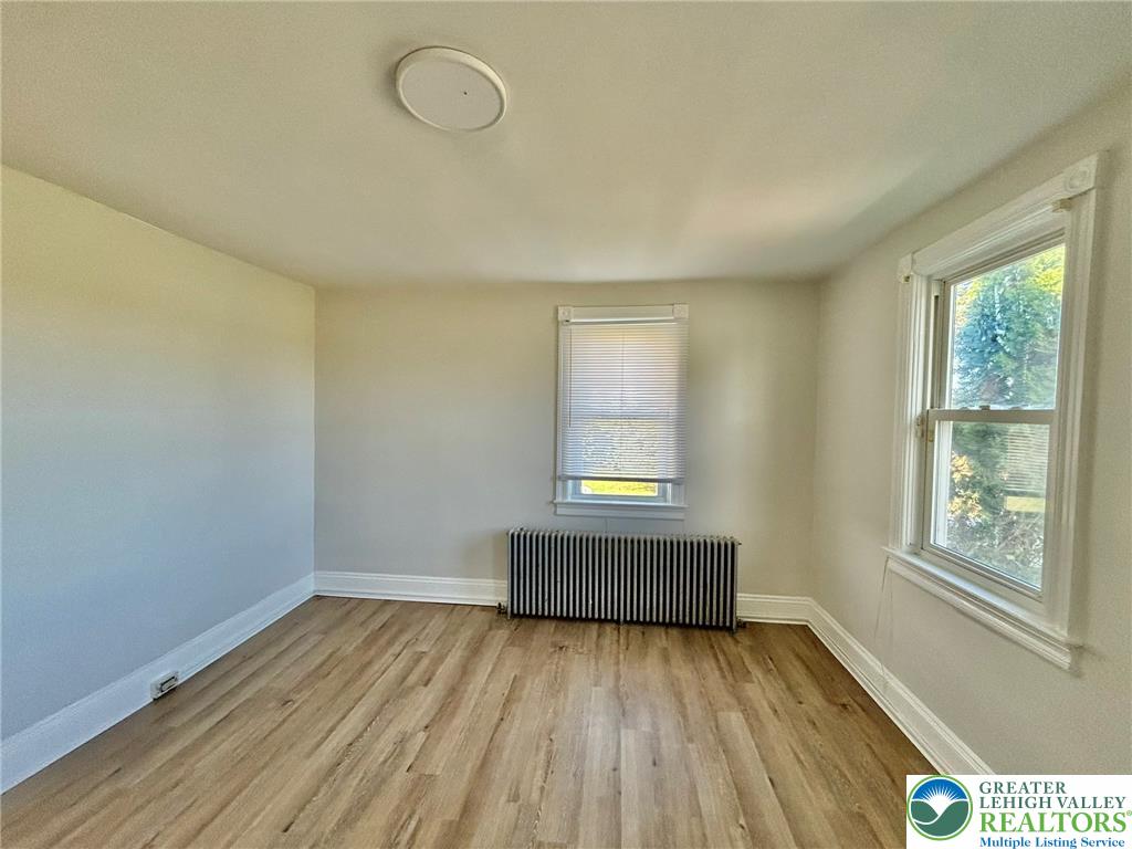 4067 Newburg Road Bethlehem, PA 18020 - Photo 16 of 19 Gleaming wood floors and classic moldings frame this versatile space with dual-aspect windows.