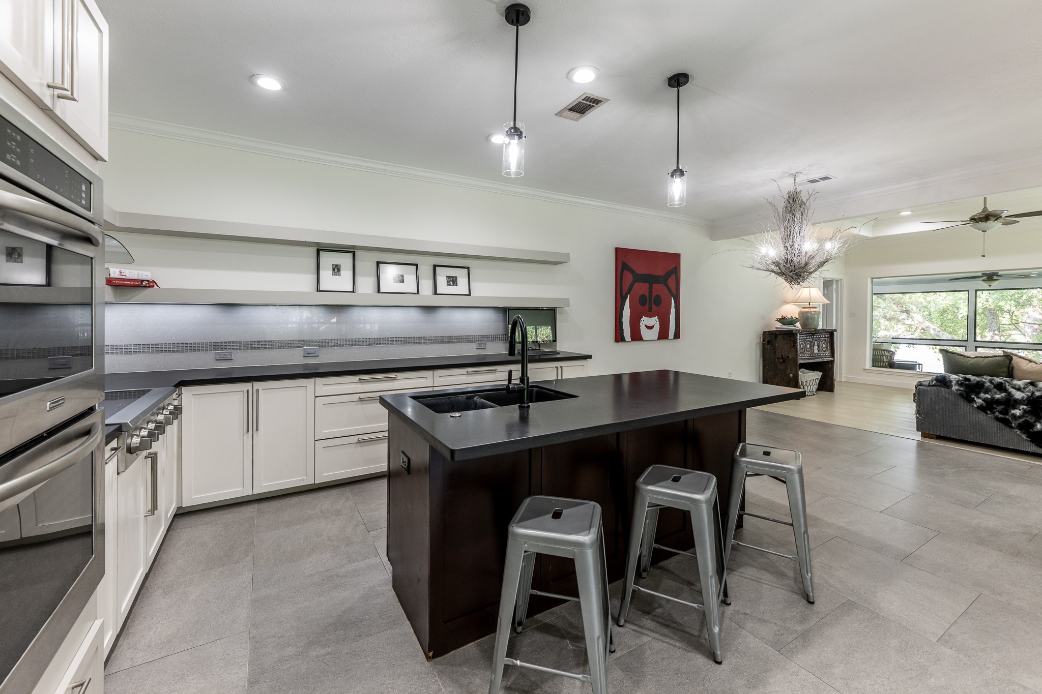 14 Lakeview Manor Huntsville, TX 77340 - Photo 12 of 48 a kitchen with stainless steel appliances granite countertop a sink a stove and chairs