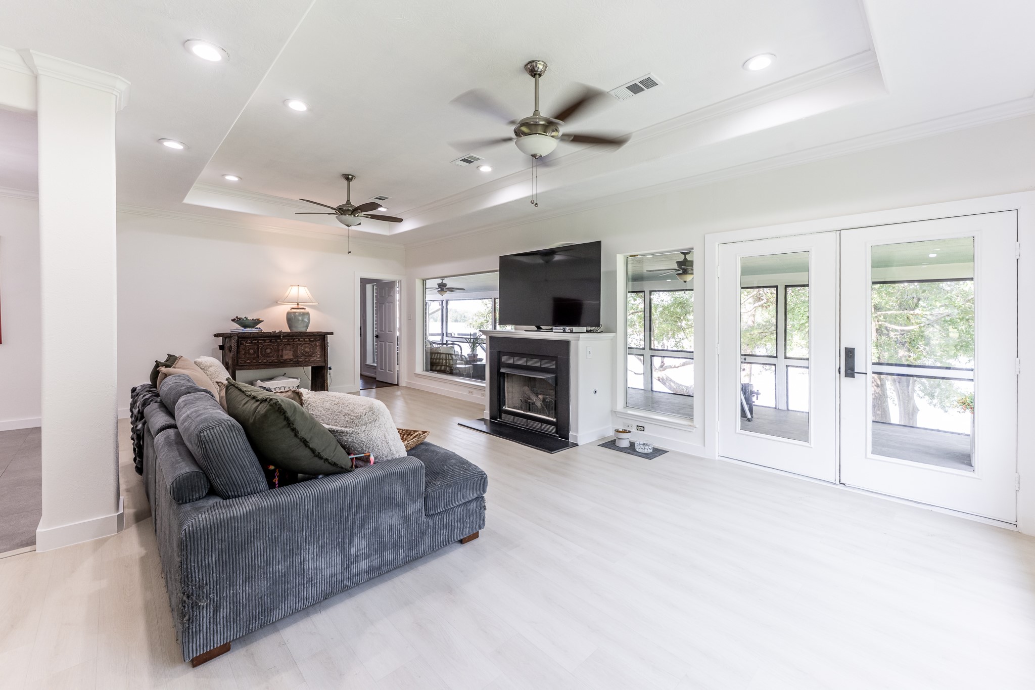14 Lakeview Manor Huntsville, TX 77340 - Photo 19 of 48 a living room with furniture a flat screen tv and a fireplace