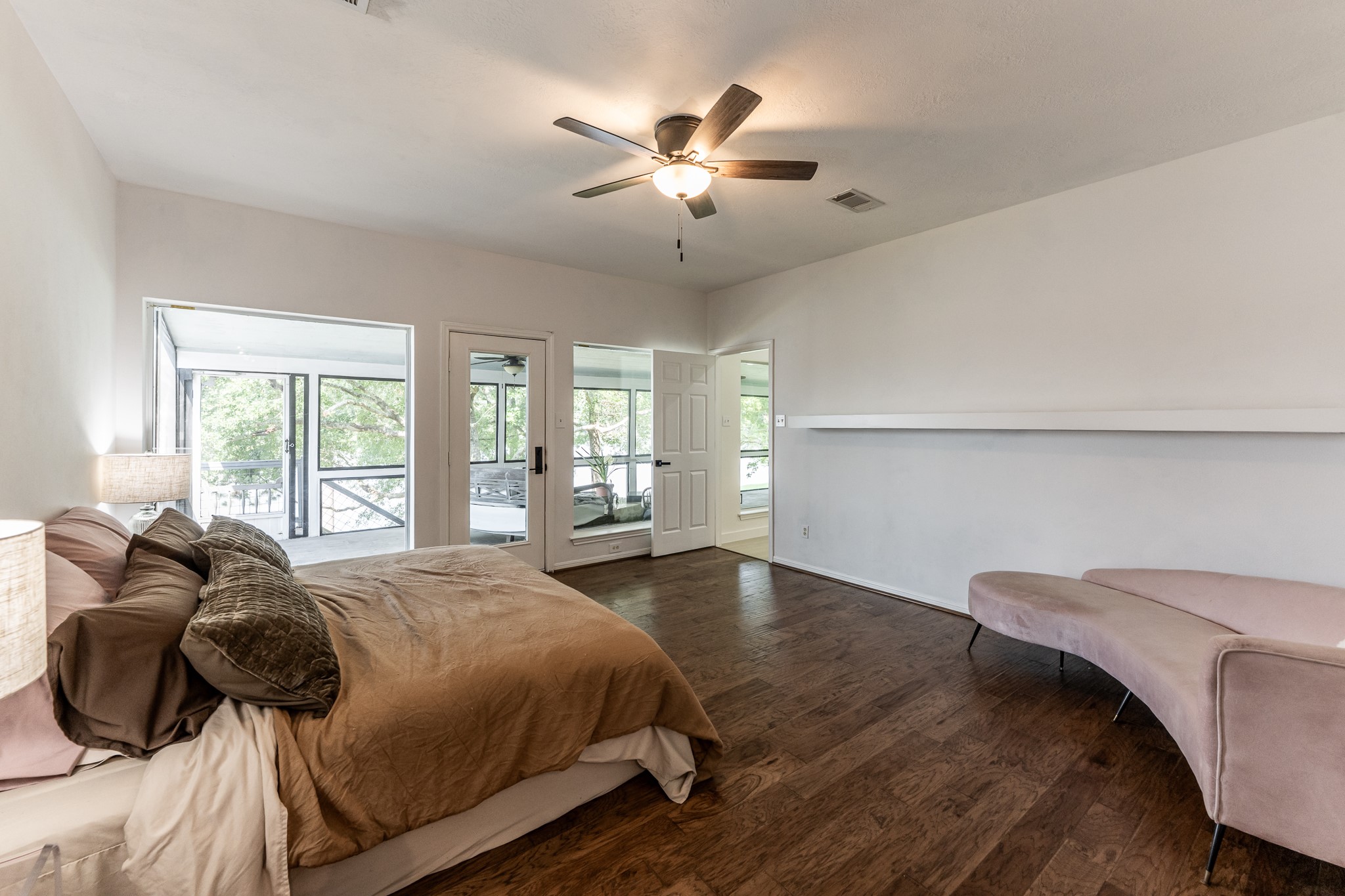 14 Lakeview Manor Huntsville, TX 77340 - Photo 26 of 48 a bed sitting in a bedroom next to a window