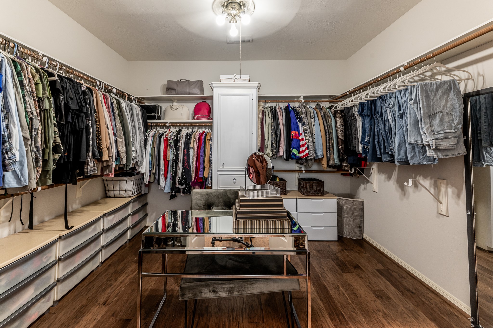 14 Lakeview Manor Huntsville, TX 77340 - Photo 27 of 48 a view of walk in closet with clothes and shoes