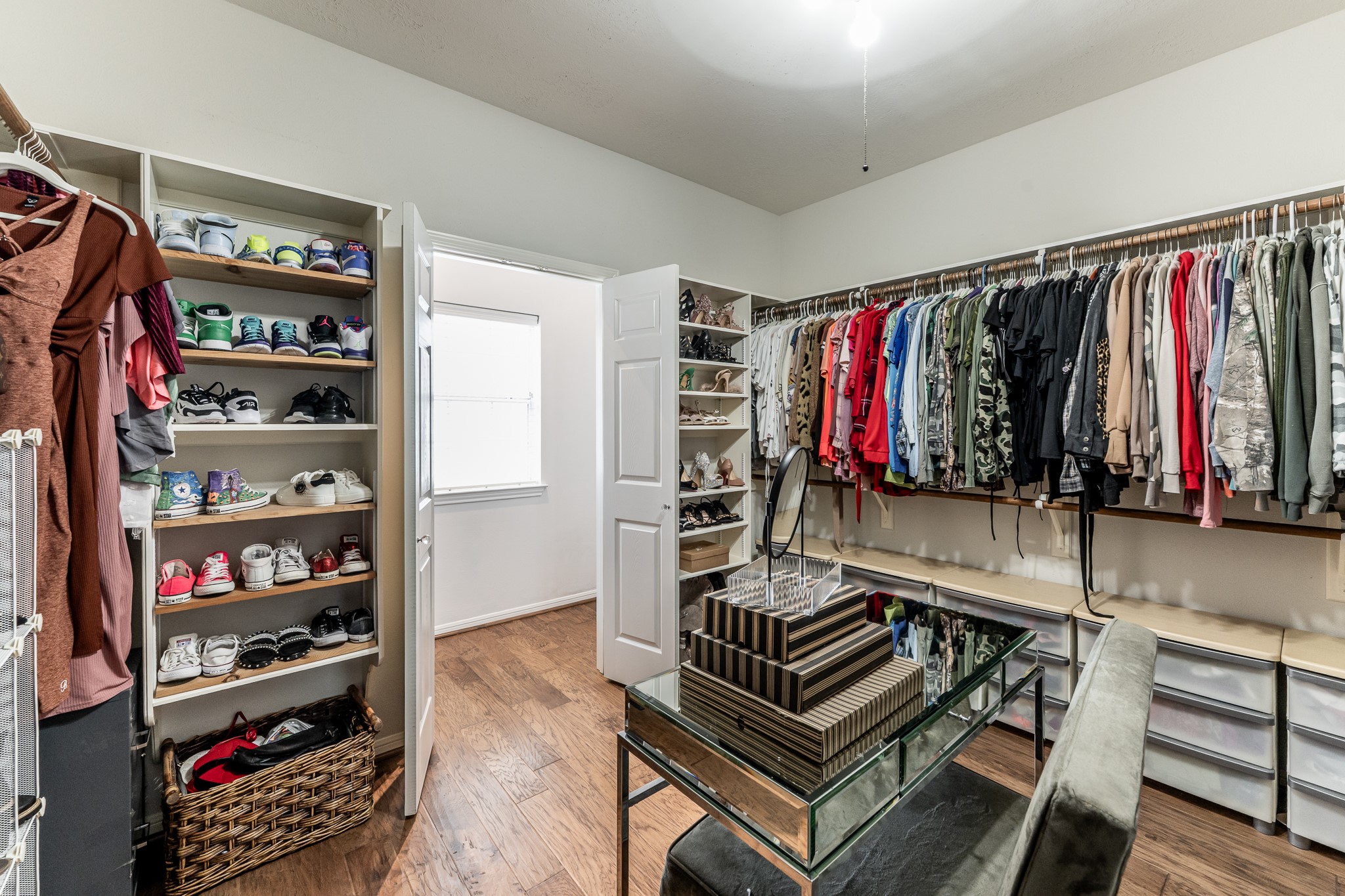 14 Lakeview Manor Huntsville, TX 77340 - Photo 28 of 48 a view of walk in closet with clothes and shoes