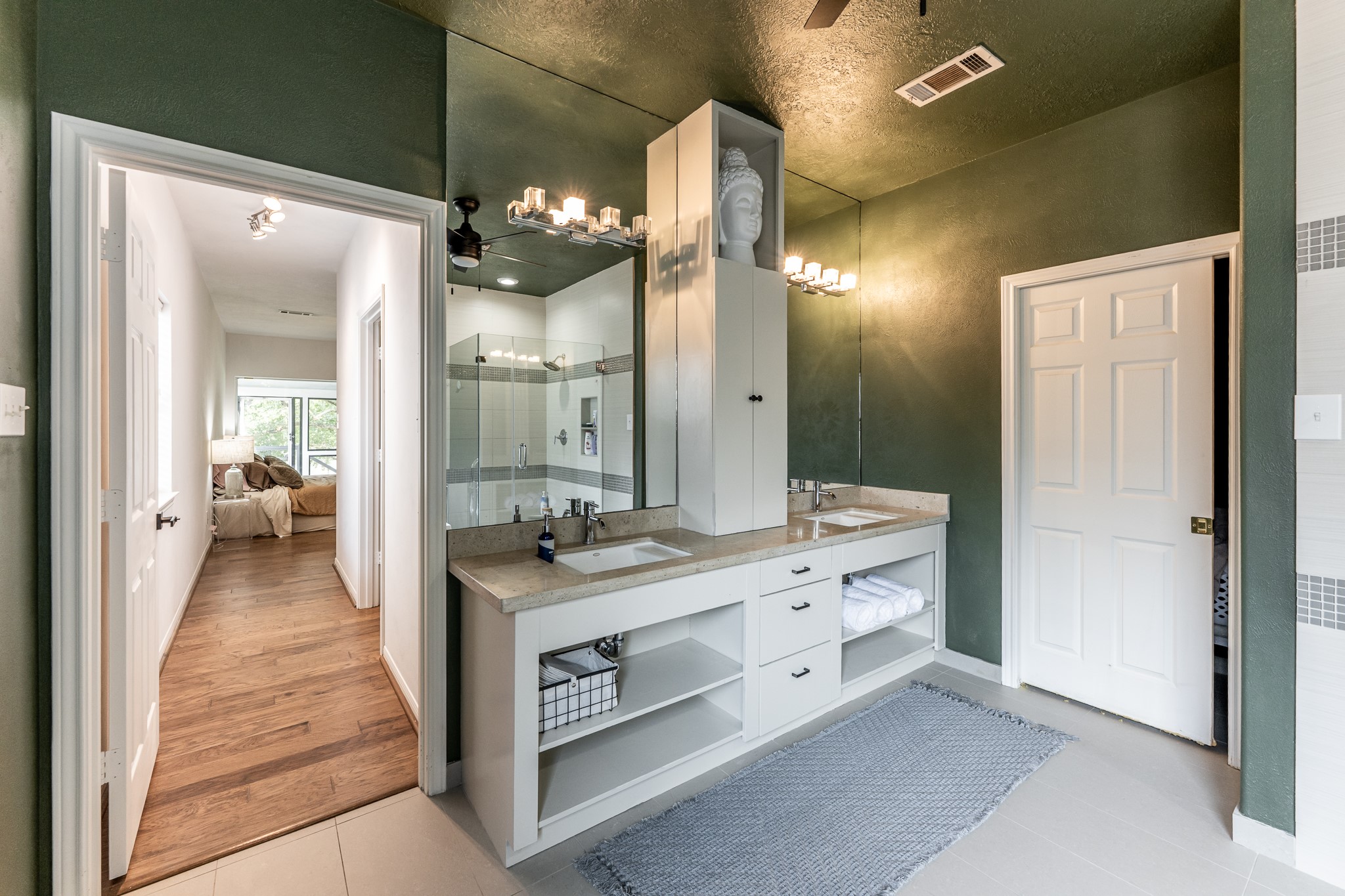 14 Lakeview Manor Huntsville, TX 77340 - Photo 32 of 48 a spacious bathroom with a granite countertop sink a mirror and a shower
