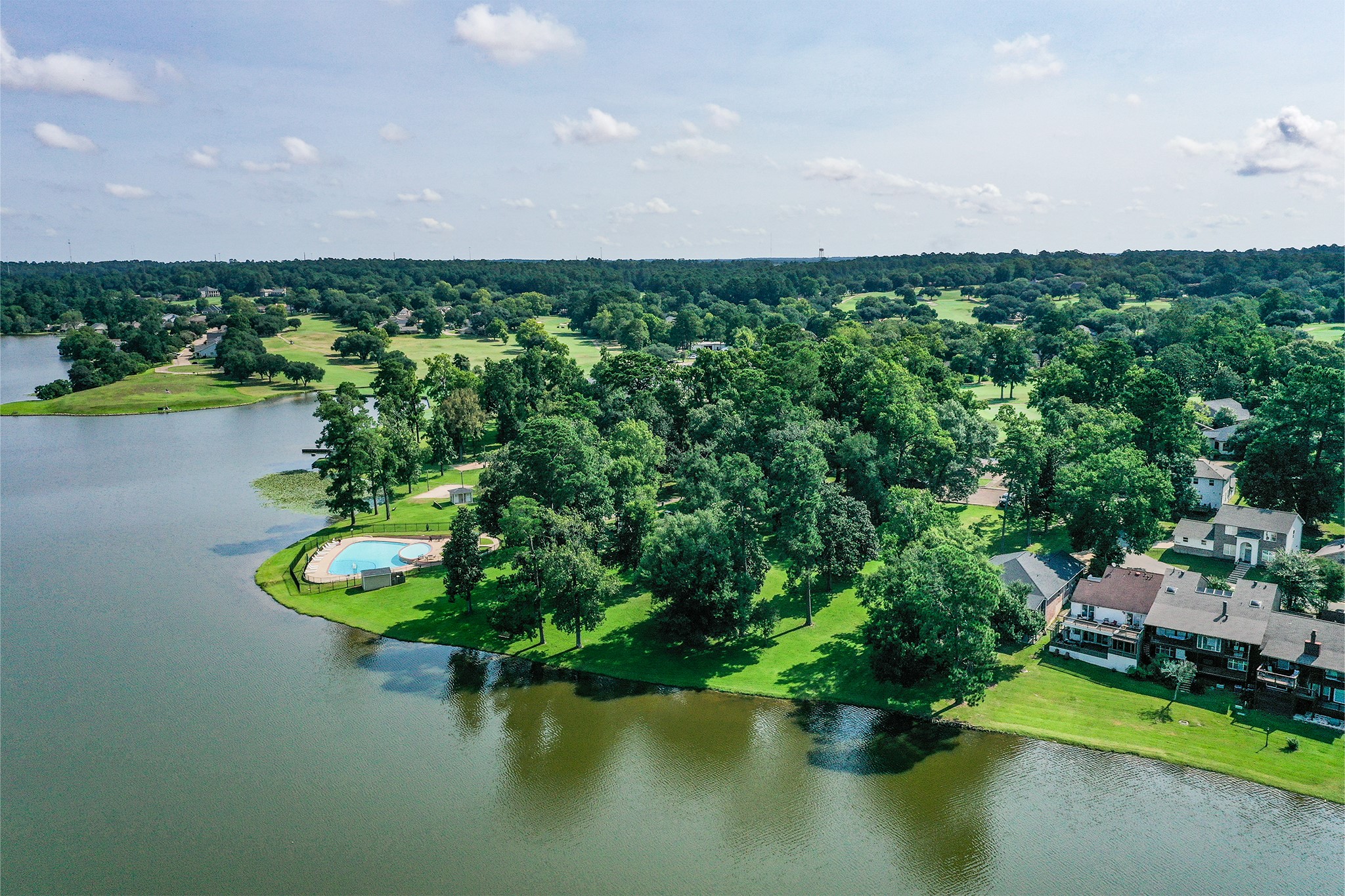14 Lakeview Manor Huntsville, TX 77340 - Photo 5 of 48 an aerial view of a house with a yard and lake view