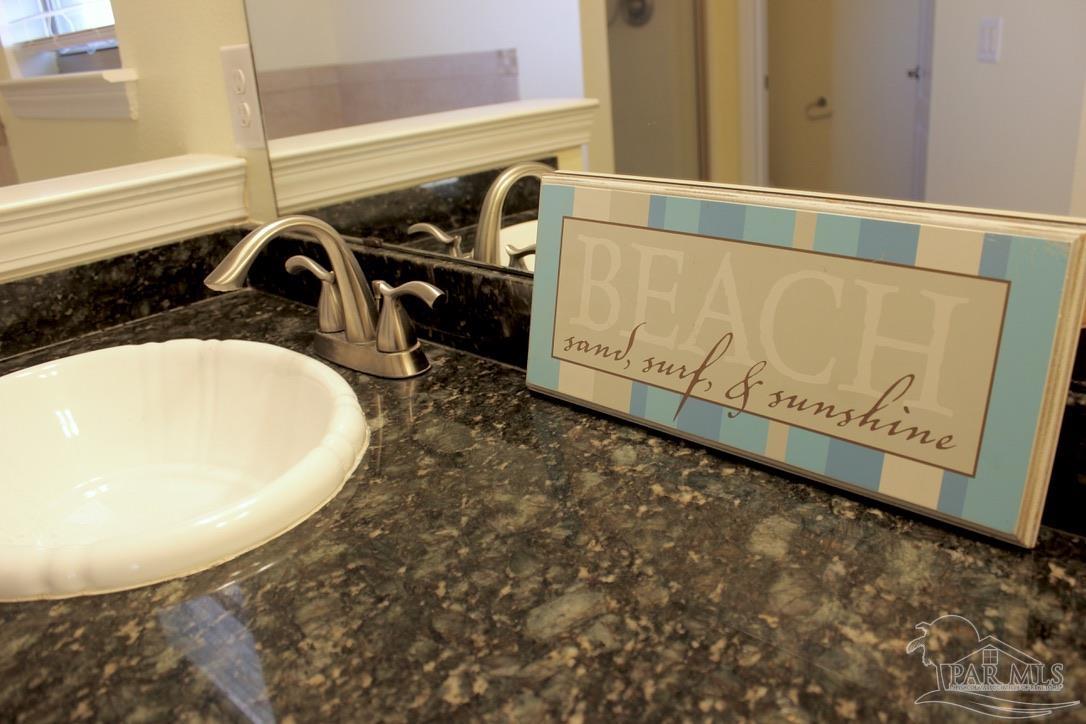 6364 Parakeet Trail Pensacola, FL 32503 - Photo 35 of 72 a bathroom with a sink and mirror