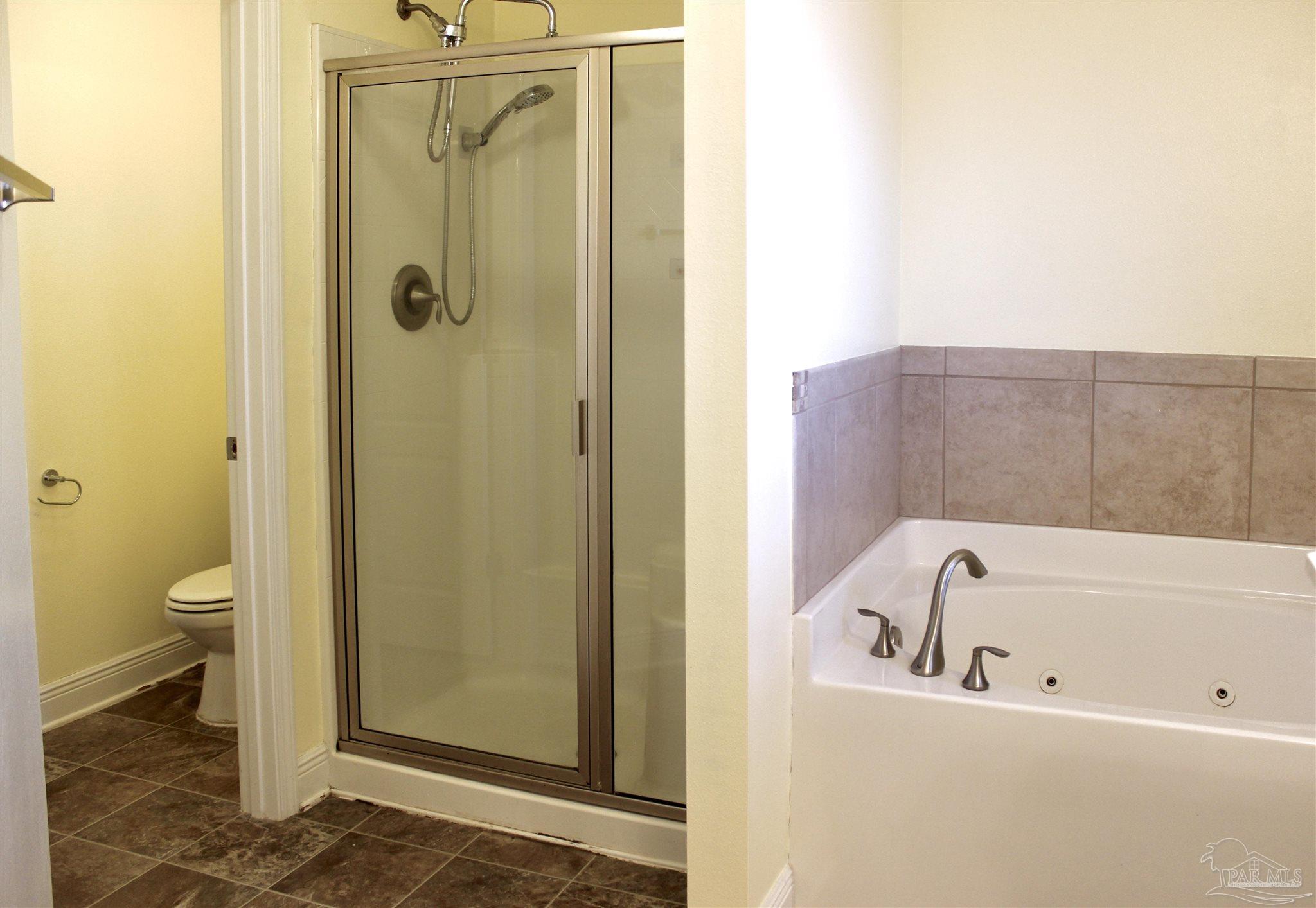 6364 Parakeet Trail Pensacola, FL 32503 - Photo 40 of 72 a bathroom with a bathtub and a shower