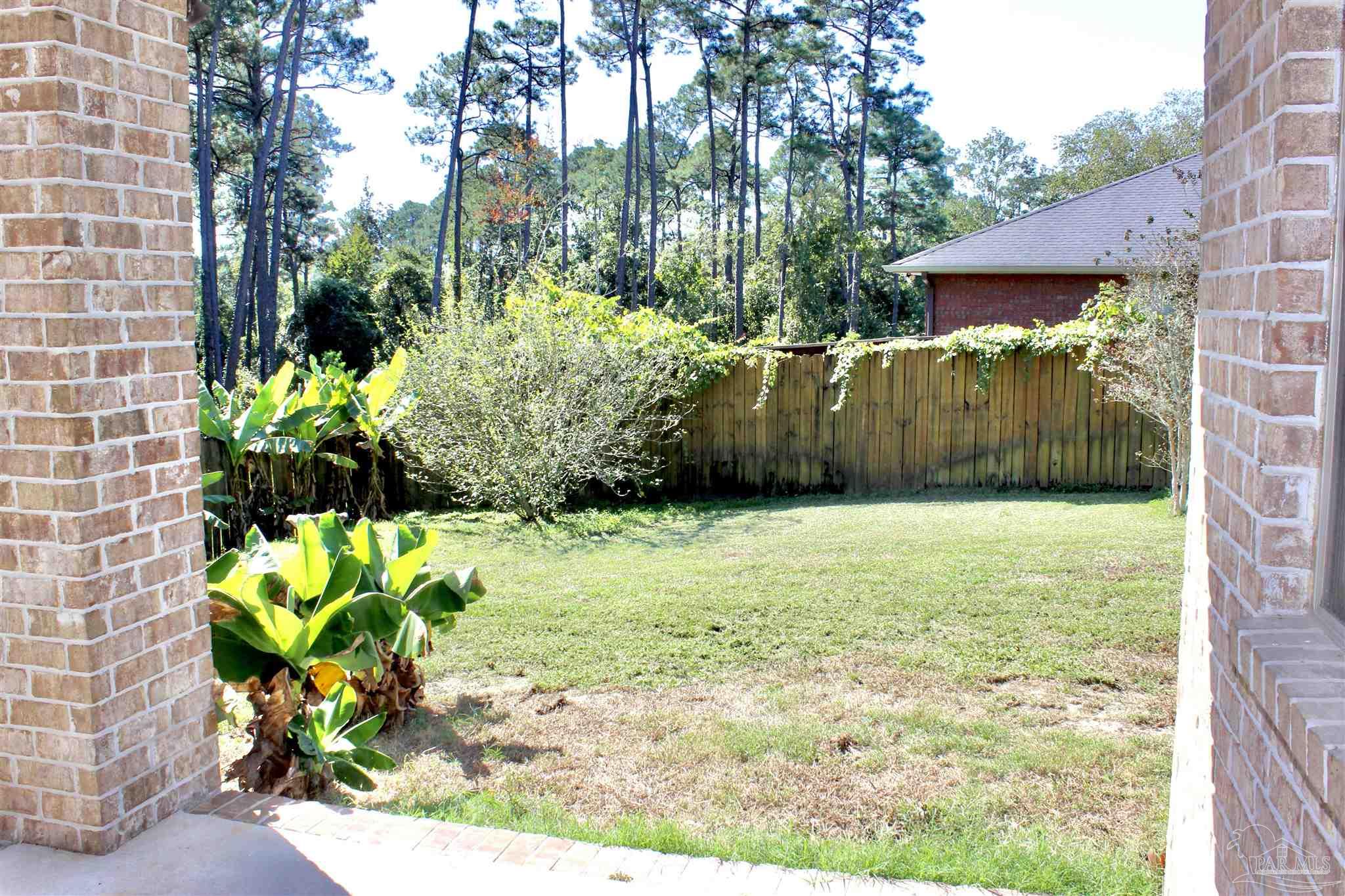 6364 Parakeet Trail Pensacola, FL 32503 - Photo 48 of 72 a view of a garden with a chair