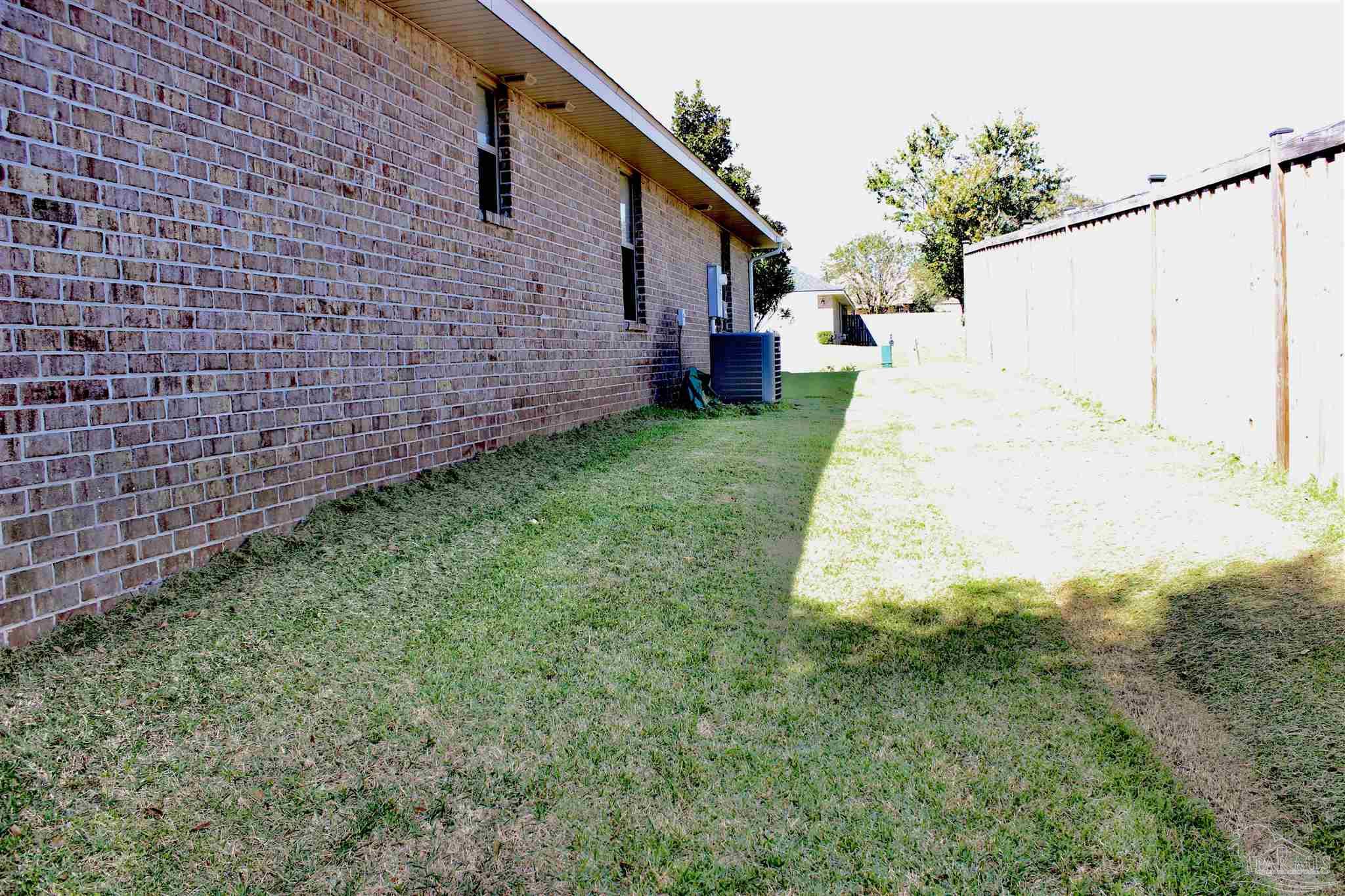 6364 Parakeet Trail Pensacola, FL 32503 - Photo 65 of 72 a view of a backyard with plants