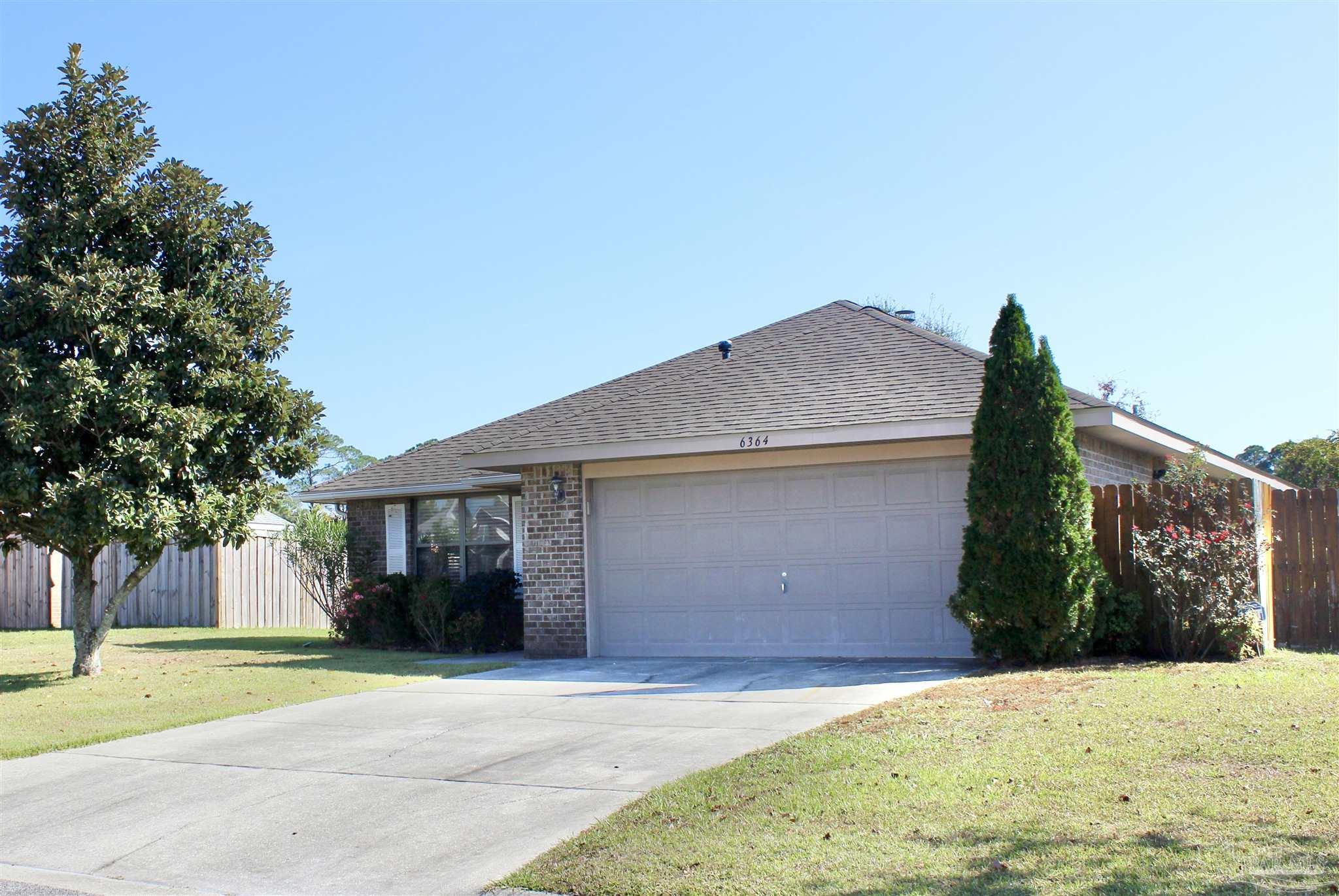 6364 Parakeet Trail Pensacola, FL 32503 - Photo 71 of 72 a front view of a house with a yard and garage