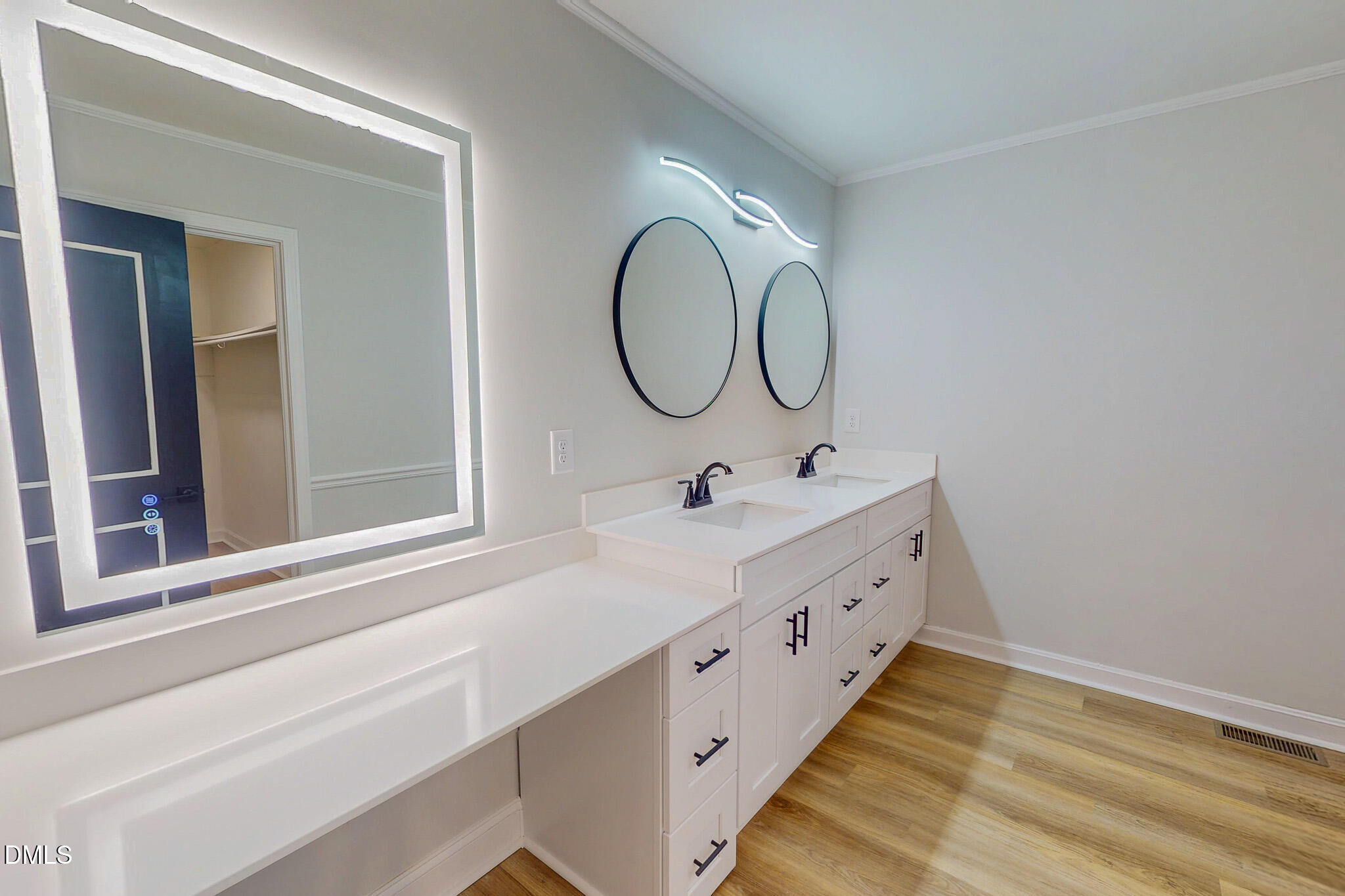 844 Holeman Ashley Road Timberlake, NC 27583 - Photo 11 of 58 a bathroom with a double vanity sink and a mirror