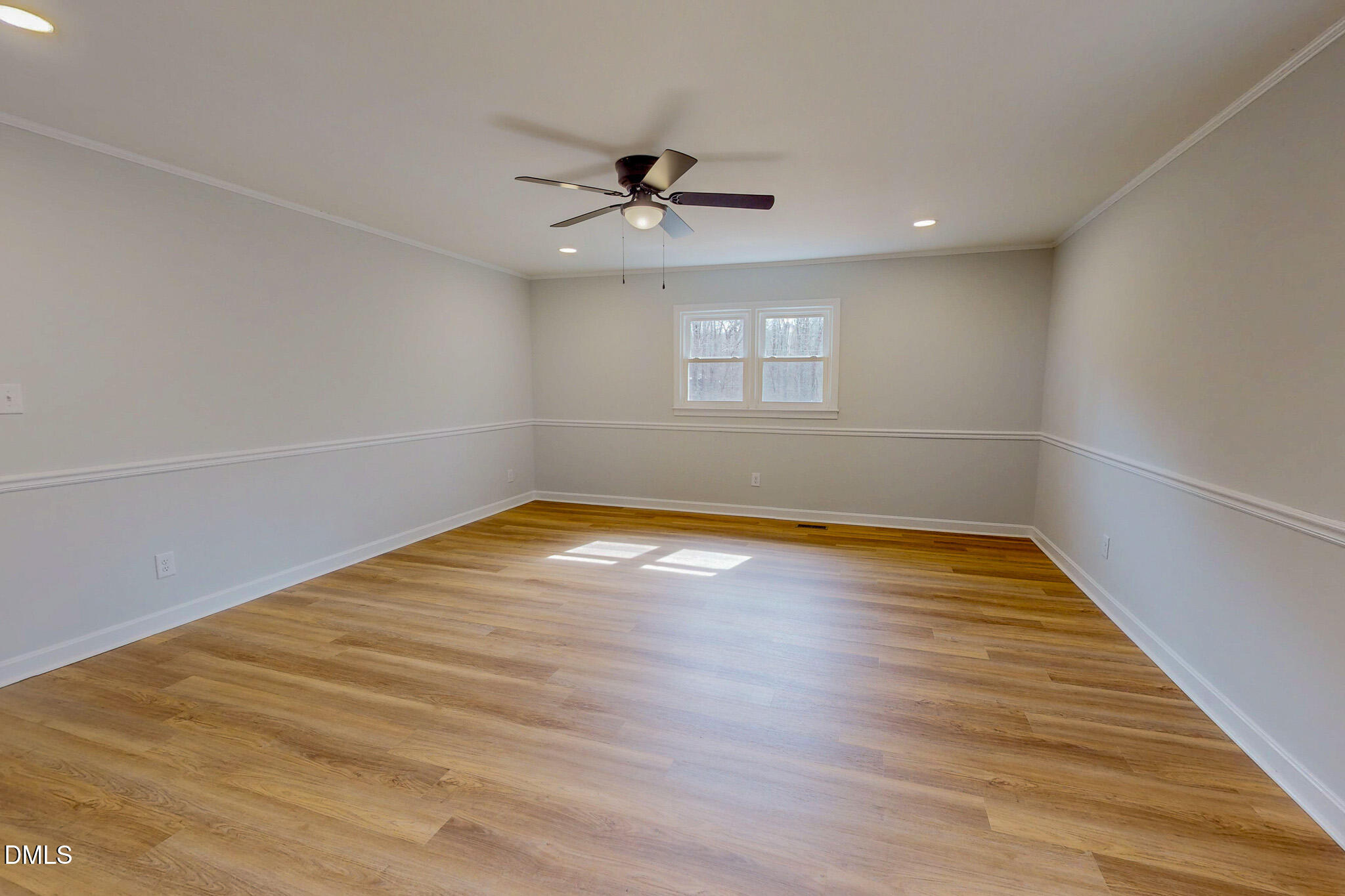 844 Holeman Ashley Road Timberlake, NC 27583 - Photo 19 of 58 wooden floor in an empty room with a window