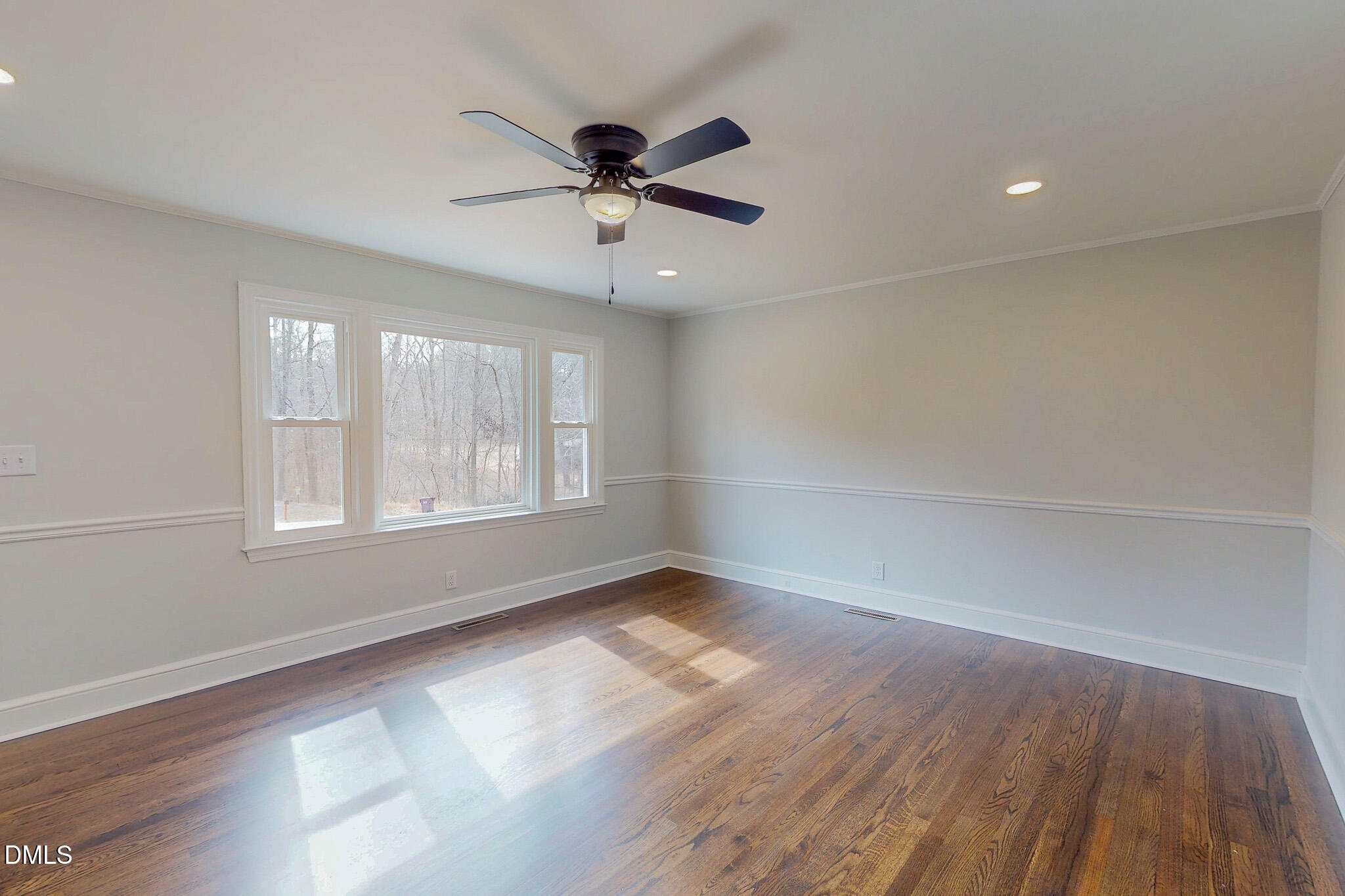 844 Holeman Ashley Road Timberlake, NC 27583 - Photo 29 of 58 wooden floor in an empty room with a window
