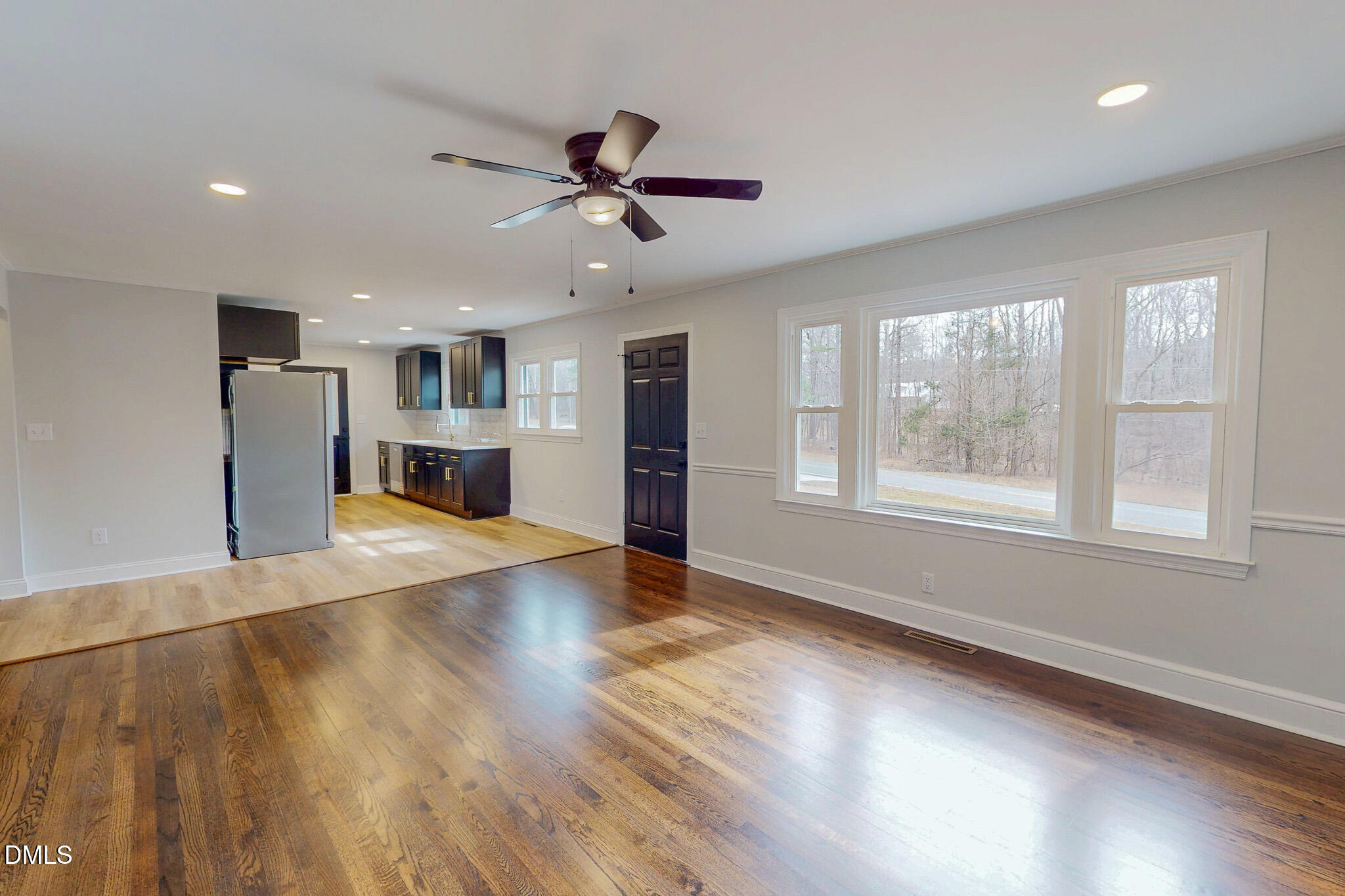 844 Holeman Ashley Road Timberlake, NC 27583 - Photo 30 of 58 a view of an empty room with a window and wooden floor