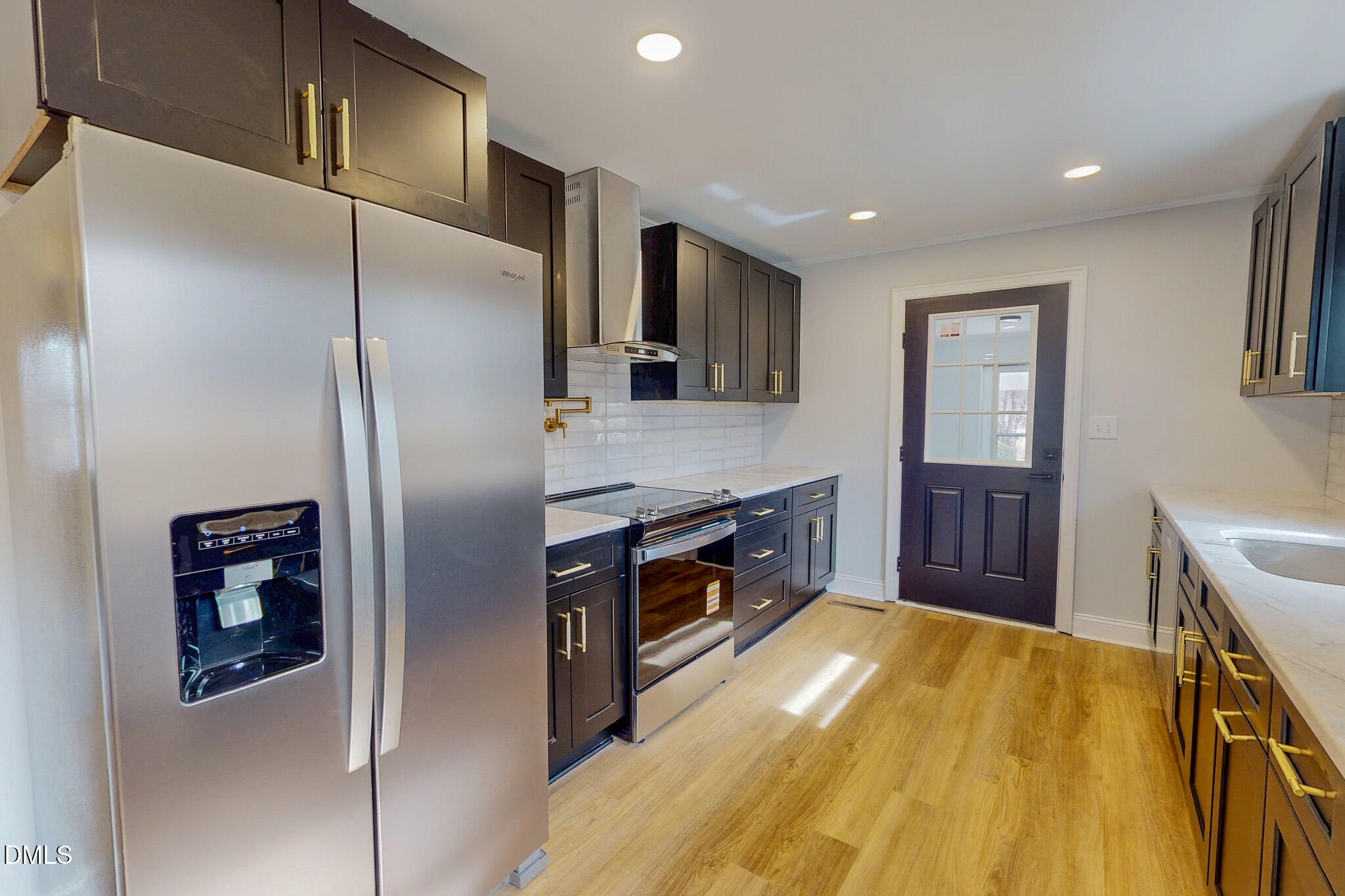 844 Holeman Ashley Road Timberlake, NC 27583 - Photo 3 of 58 a kitchen with stainless steel appliances granite countertop a refrigerator and a sink