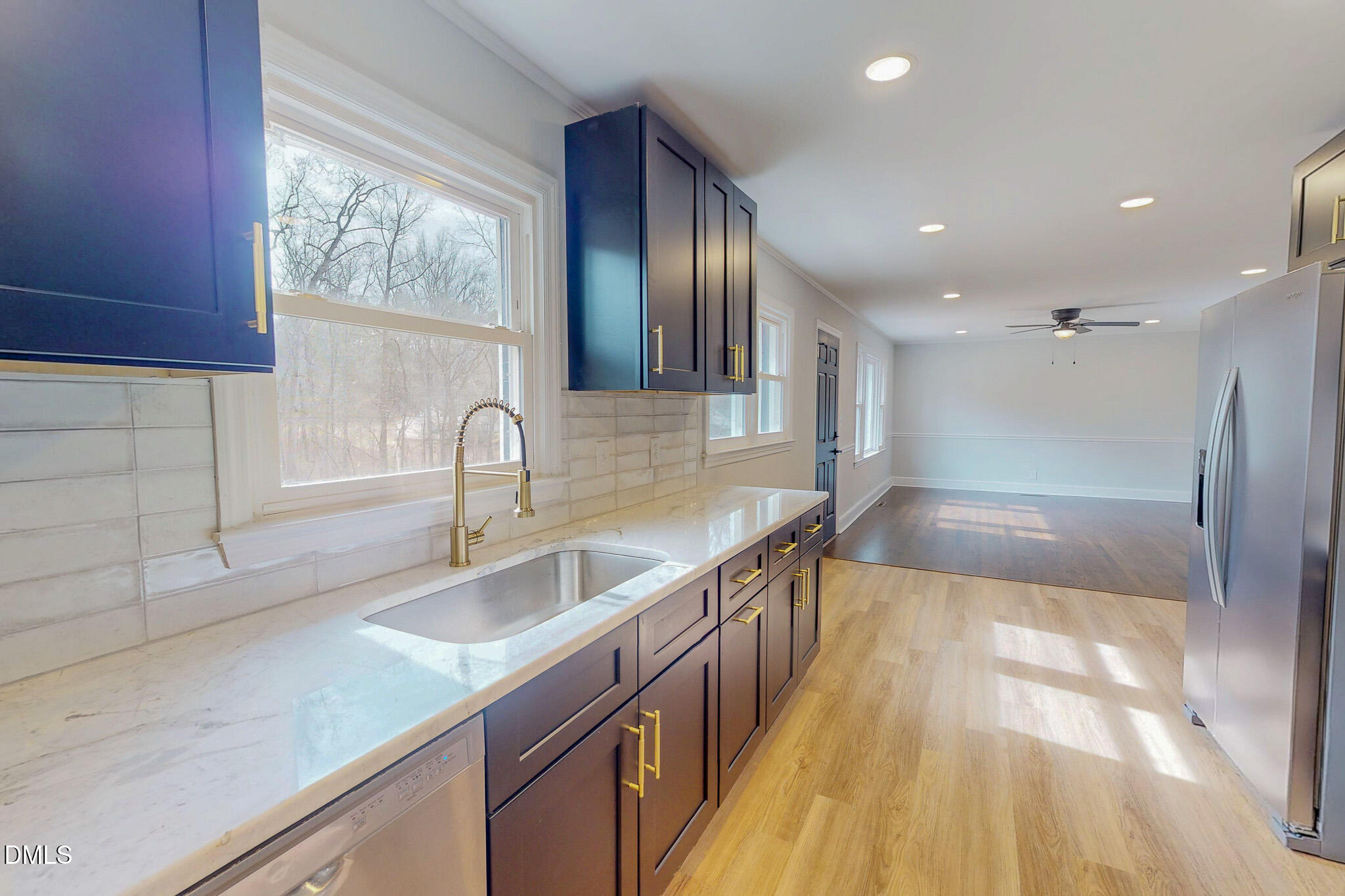 844 Holeman Ashley Road Timberlake, NC 27583 - Photo 32 of 58 a kitchen with stainless steel appliances granite countertop a sink and a stove