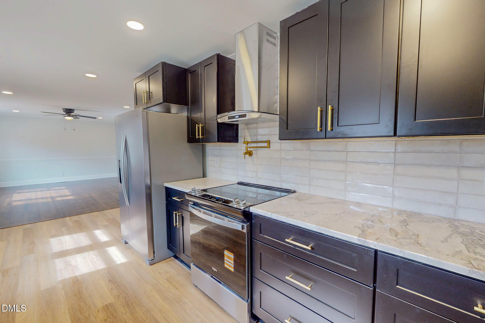 844 Holeman Ashley Road Timberlake, NC 27583 - Photo 33 of 58 a kitchen with granite countertop a stove and a refrigerator