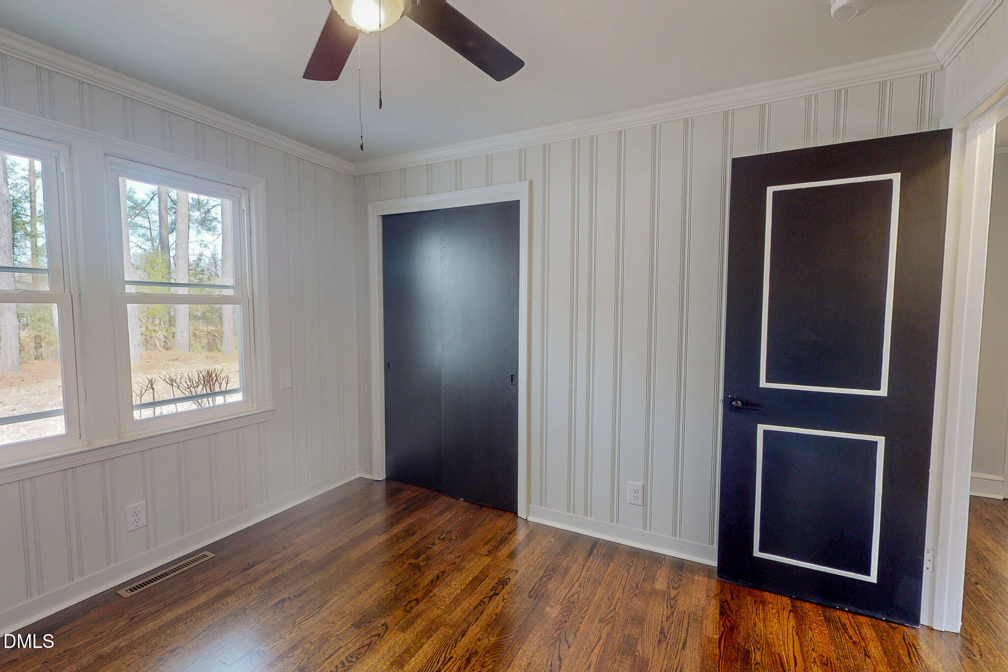 844 Holeman Ashley Road Timberlake, NC 27583 - Photo 35 of 58 a view of an empty room with wooden floor and a window