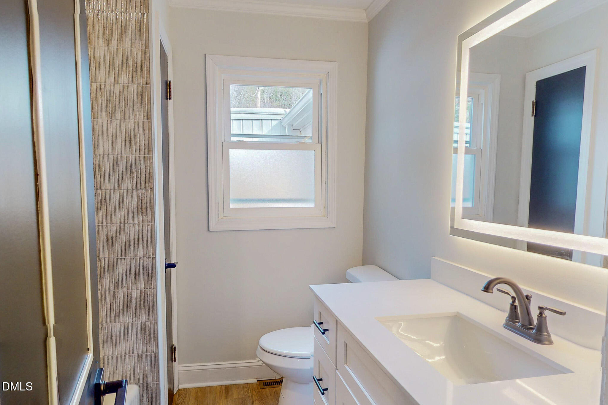 844 Holeman Ashley Road Timberlake, NC 27583 - Photo 36 of 58 a bathroom with a sink toilet and vanity