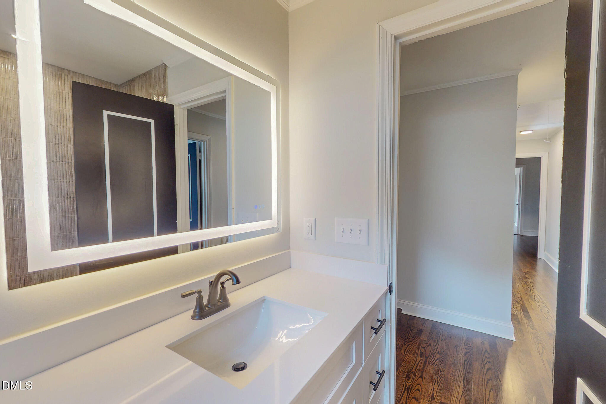 844 Holeman Ashley Road Timberlake, NC 27583 - Photo 37 of 58 a bathroom with a sink and a mirror
