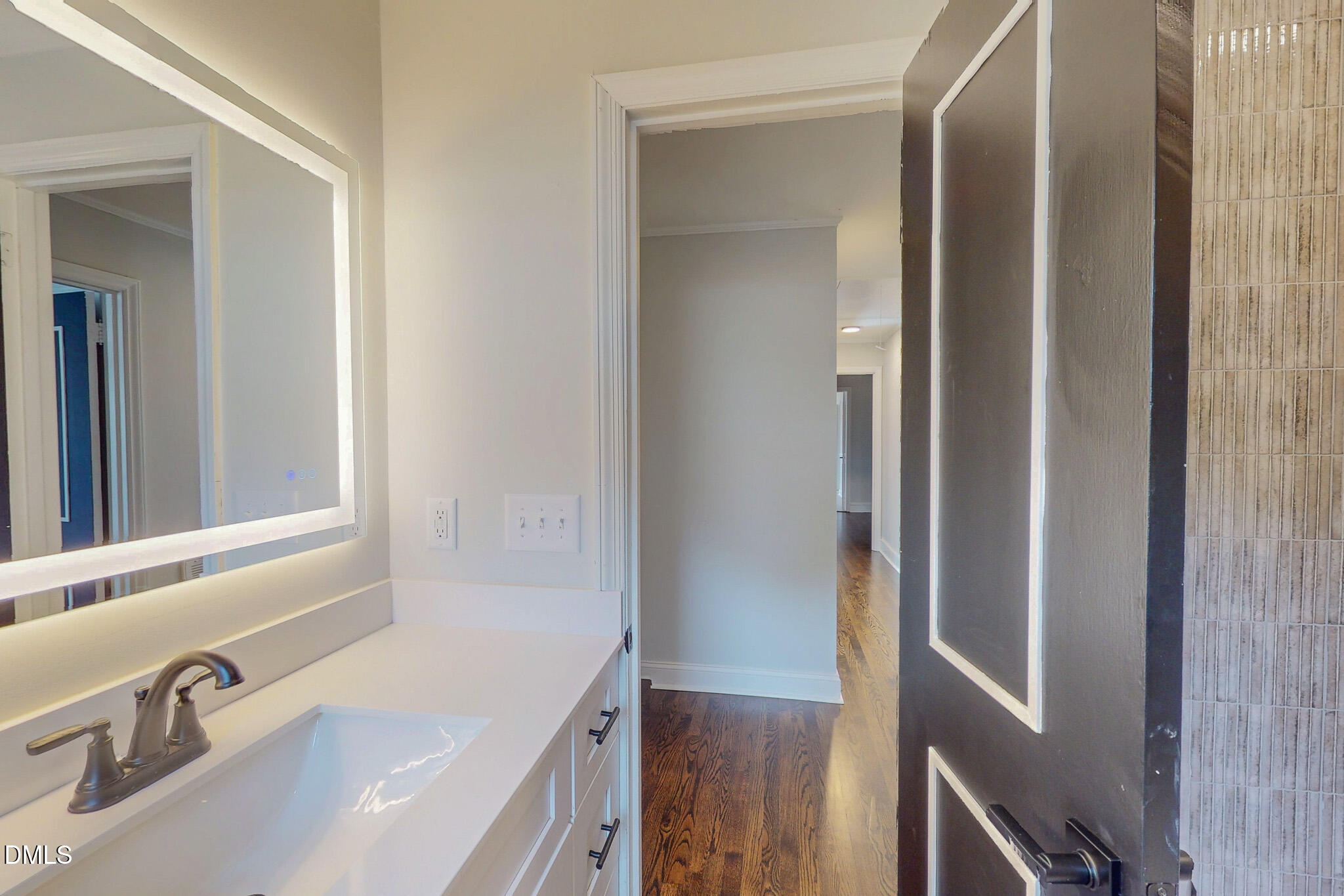 844 Holeman Ashley Road Timberlake, NC 27583 - Photo 39 of 58 a bathroom with a tub sink and mirror