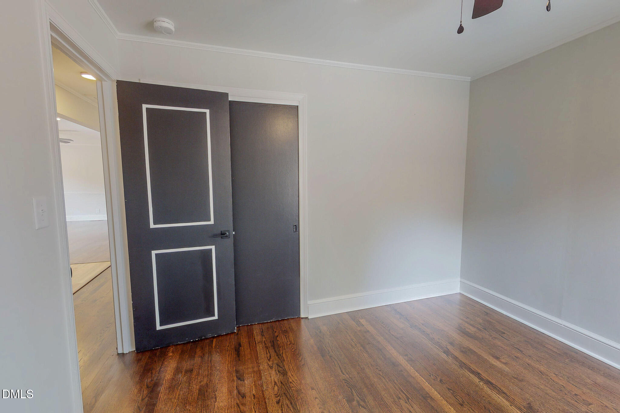 844 Holeman Ashley Road Timberlake, NC 27583 - Photo 44 of 58 a view of an empty room with wooden floor & closet