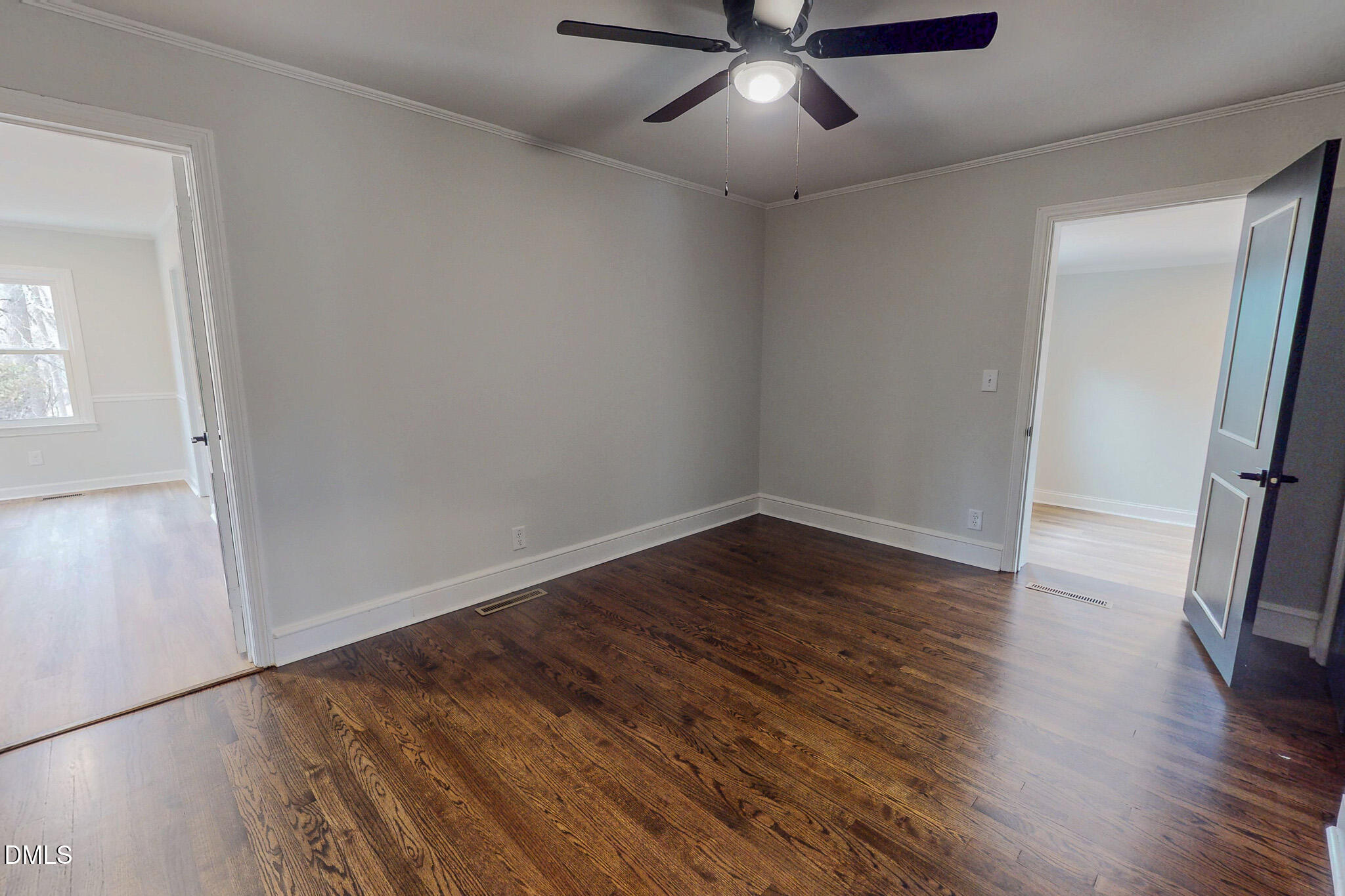 844 Holeman Ashley Road Timberlake, NC 27583 - Photo 45 of 58 an empty room with wooden floor and windows