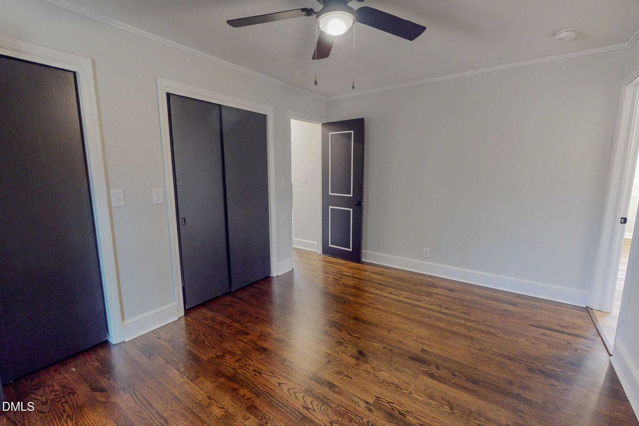 844 Holeman Ashley Road Timberlake, NC 27583 - Photo 47 of 58 wooden floor in an empty room with a window