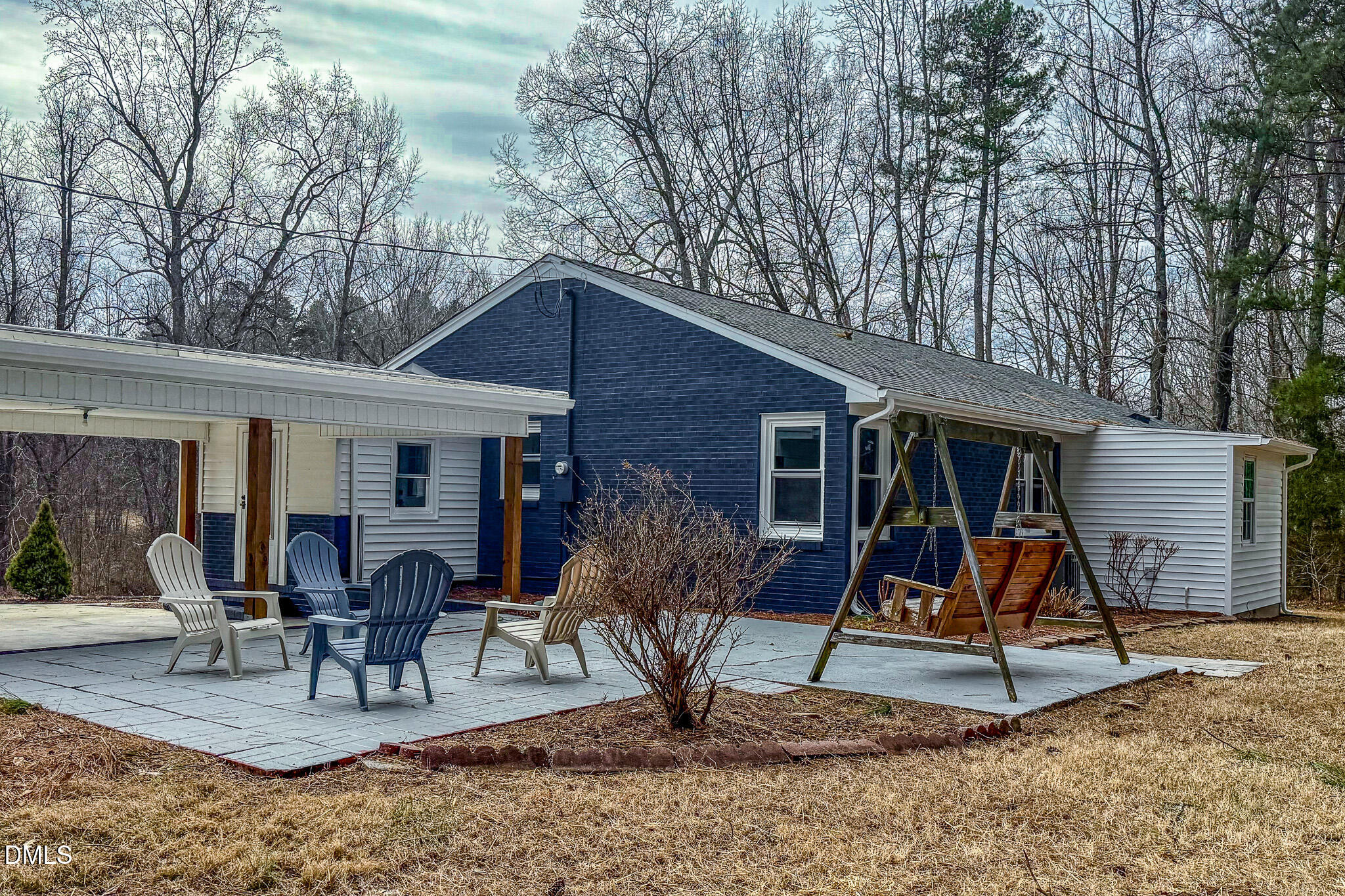 844 Holeman Ashley Road Timberlake, NC 27583 - Photo 5 of 58 a view of a house with patio furniture and a slide