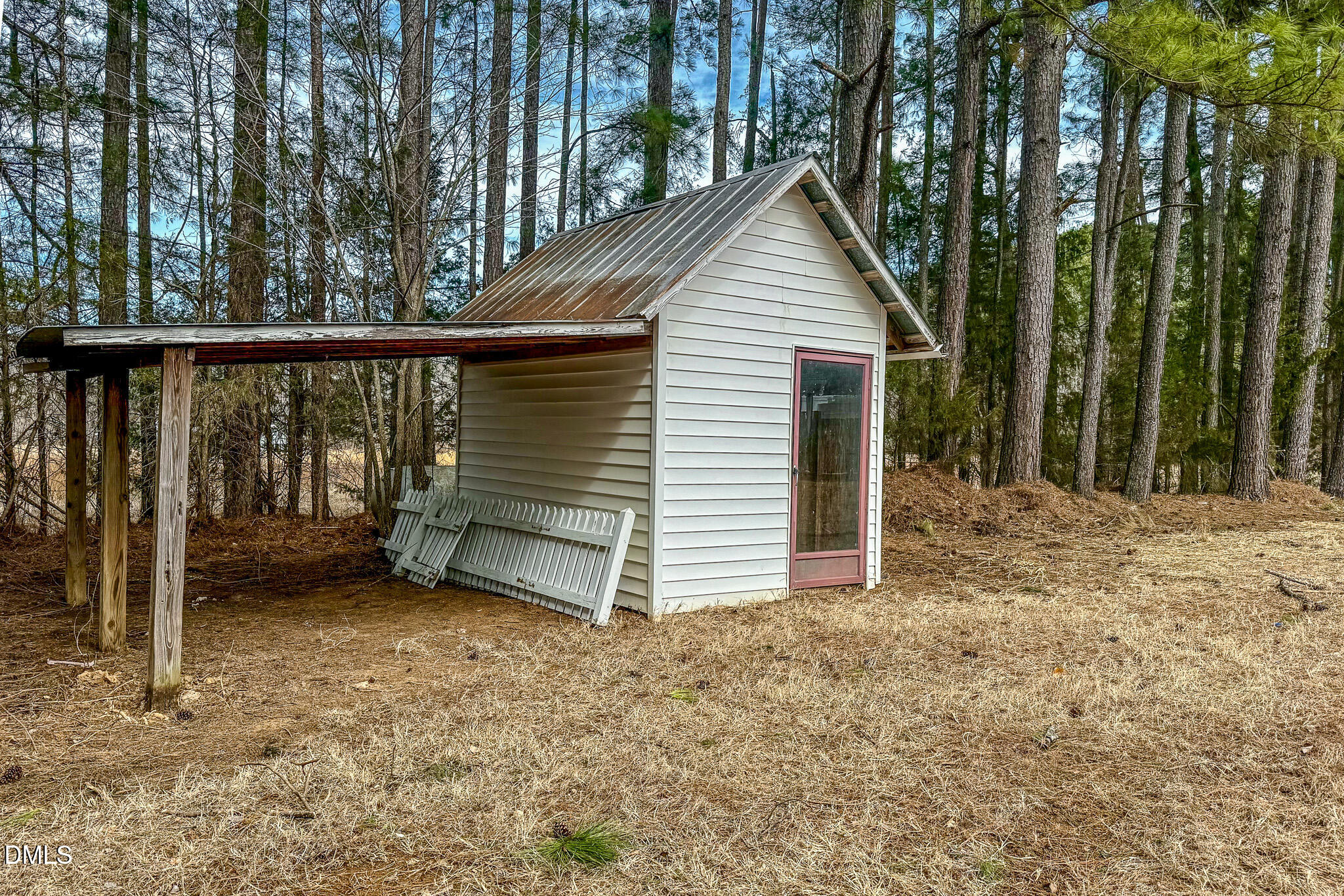 844 Holeman Ashley Road Timberlake, NC 27583 - Photo 54 of 58 a view of a house with a fence and a tree
