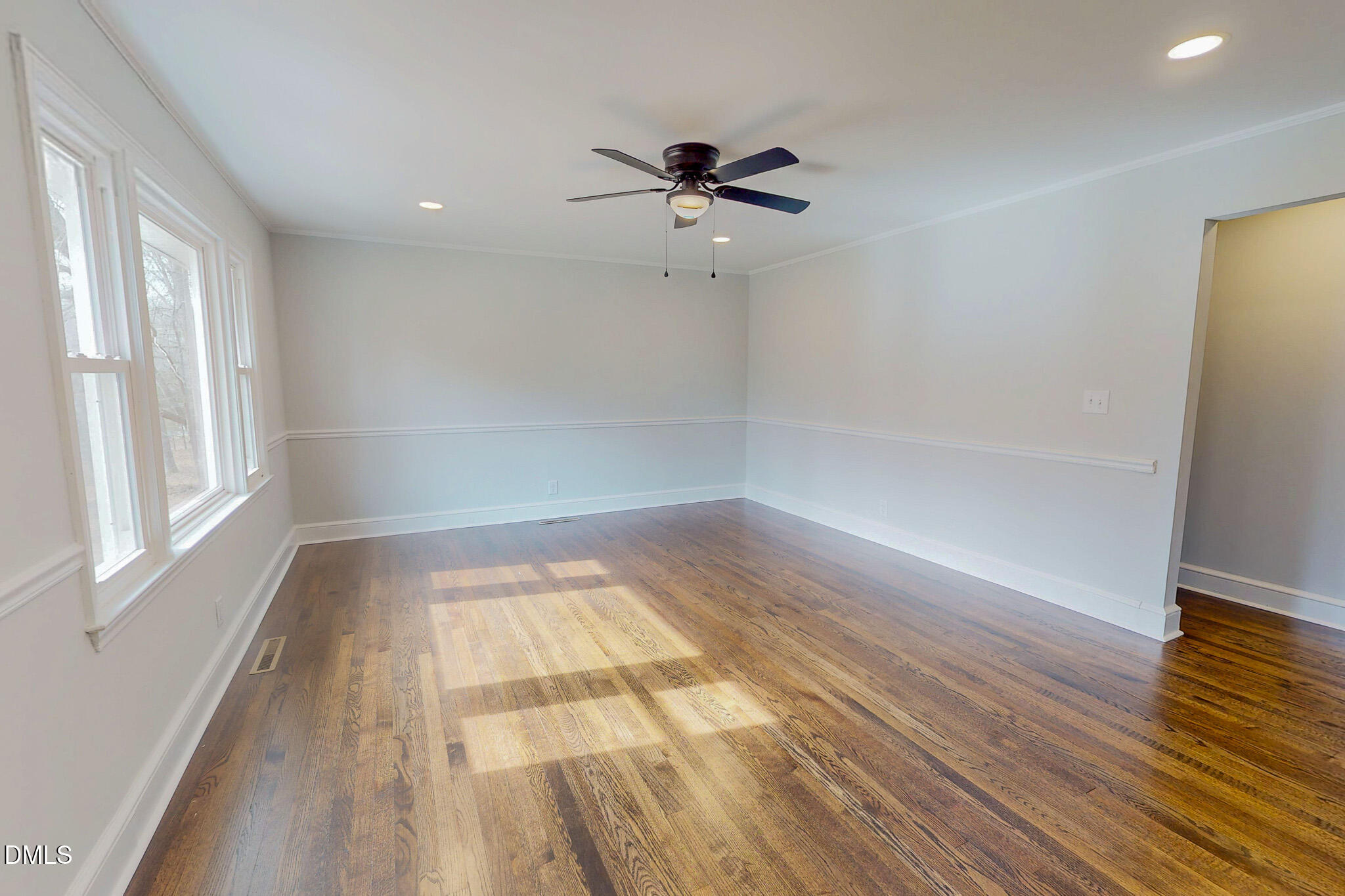 844 Holeman Ashley Road Timberlake, NC 27583 - Photo 7 of 58 wooden floor in an empty room with a window
