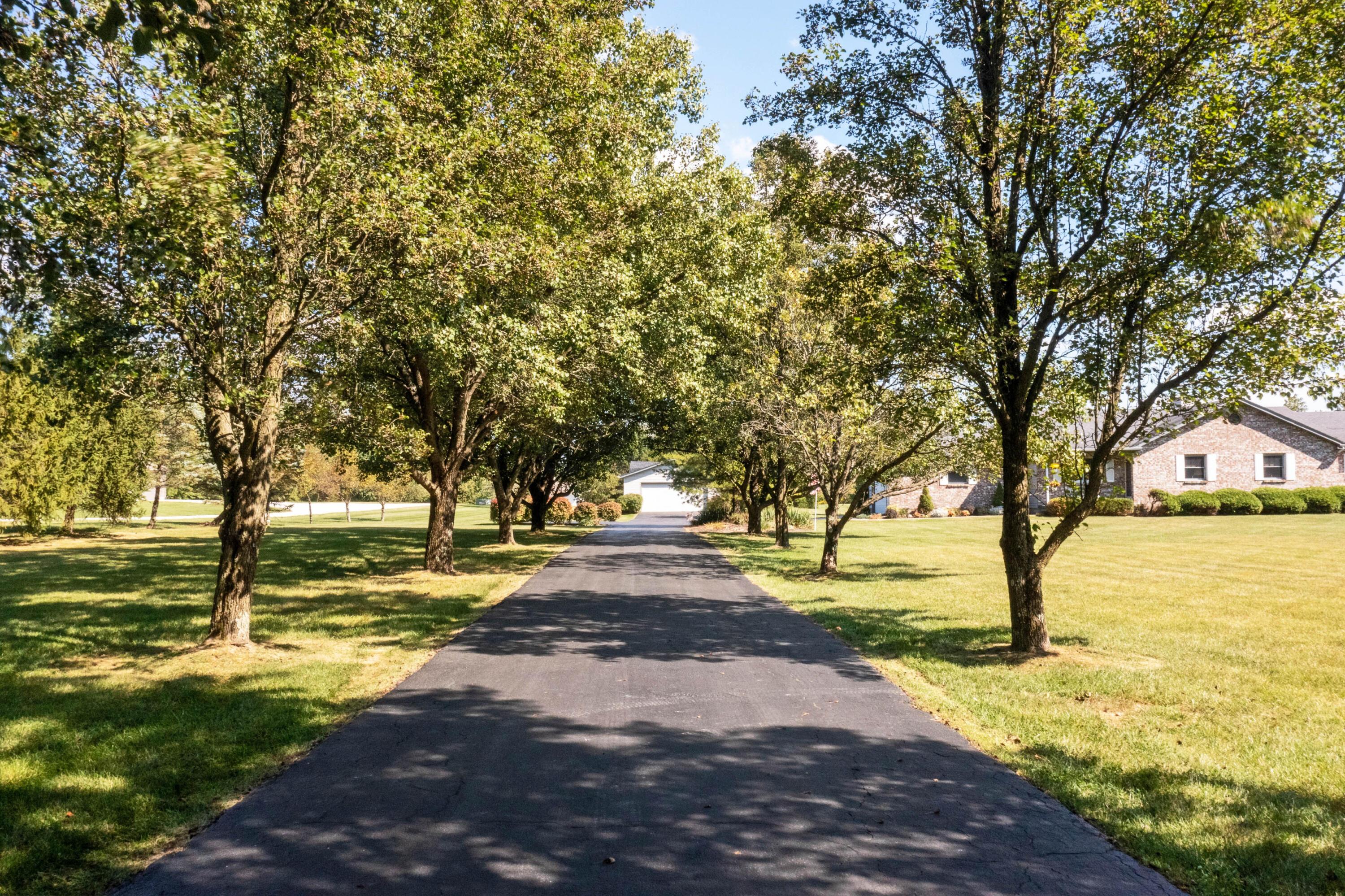 4947 Summit Road Southwest Pataskala, OH 43062 - Photo 3 of 38 TREE LINED DRIVEWAY OF HOME