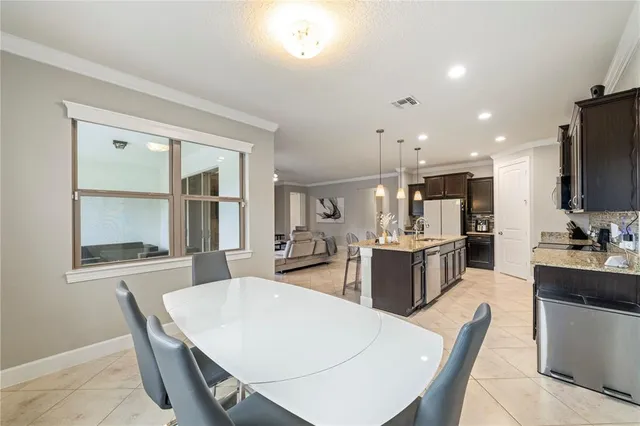 a living room with furniture and a painting